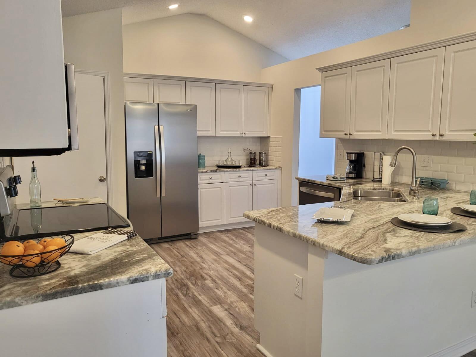 100% Move in Ready Home!New 2022 Roof, 2022 2022 Ac and 2022 Hot water Heater. Wynnehaven Bch Estate, Newly Renovated 3 Bed/2 Bath/2C Garage Home on .26 Acre. Very nice large Backyard with Privacy fence. Updated Kitchen with Granite Countertops, Subway tile backsplash and New Stainless Appliances. New Paint inside and out. New Lights and Fans, New Laminate flooring in main areas, Updated Bathrooms with vanities, mirror, lights and new luxury vinyl flooring.