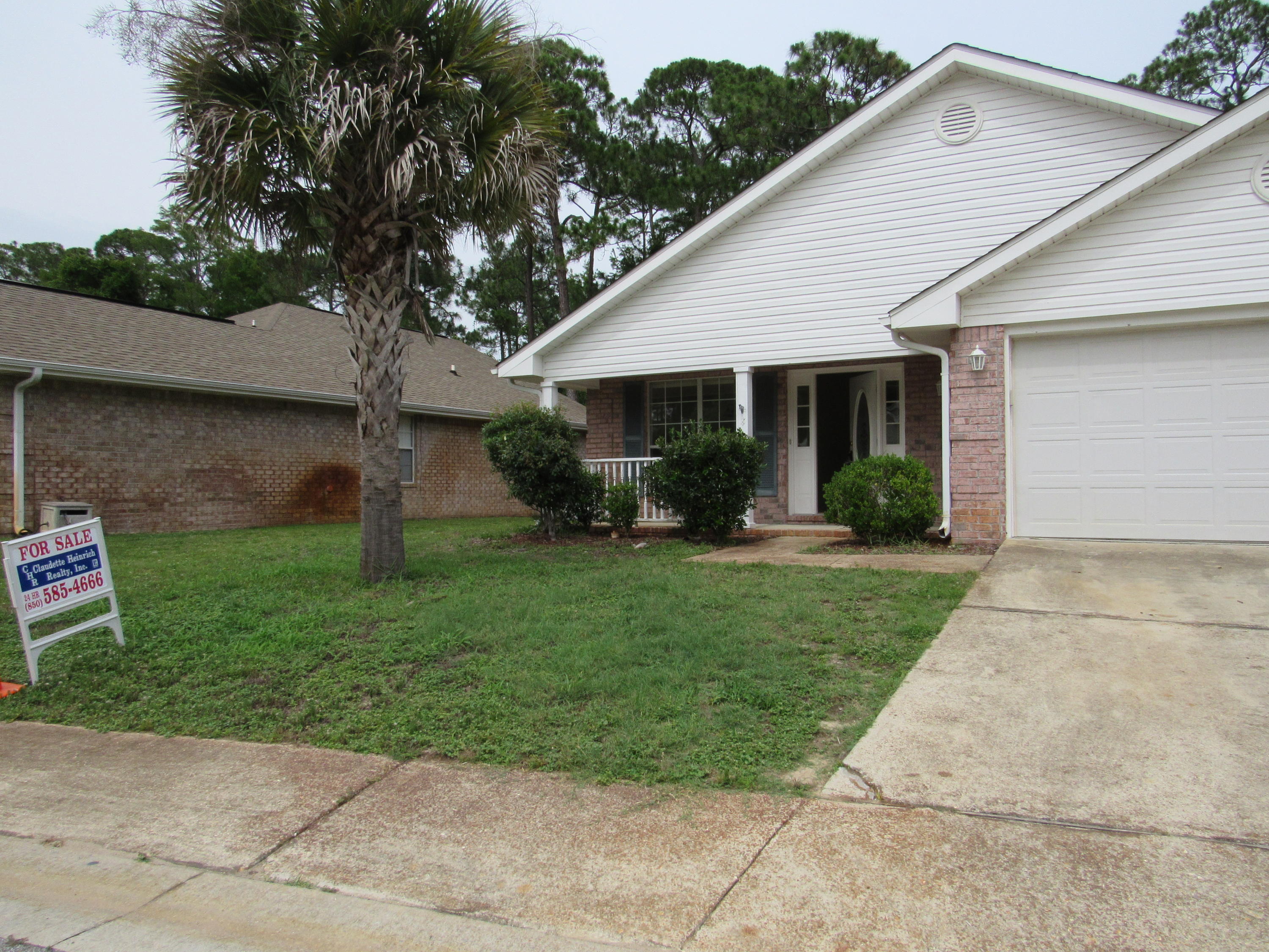 Three bedroom, 2 bath home with BEACH ACCESS in this WATERFRONT community MARSH HARBOR. Contemporary floor plan. From the porch you will walk into a living/dining/office (your choice room), leads you to a large kitchen and family room which takes you to a raised porch surrounded by greenery. Split bedrooms, master bedroom with double vanity and walk in closet. Utility room leads from the kitchen to the garage. The home needs some TLC and Owner will be doing some of those items.