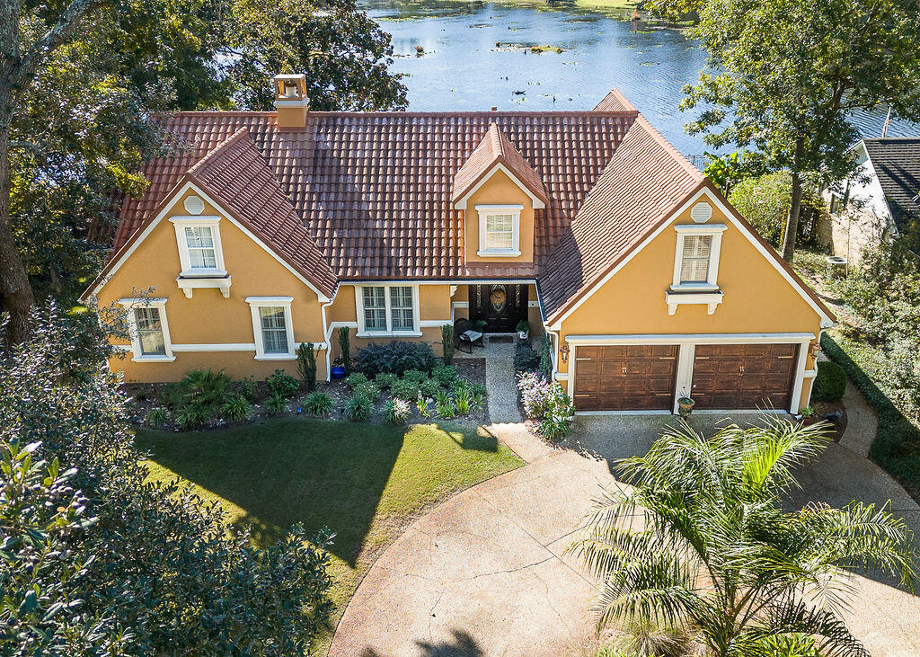Beautiful Lake Front home in the friendly neighborhood of Oaklake.  Beautifully renovated to include Stone coated metal 50 year roof (2008), newly painted stucco exterior with extra insulation for energy efficiency, new interior paint, new heated/lighted pool, new pool screen enclosure,  luxury privacy curtains in screen enclosure, lush landscaping and new low maintenance zoysia grass, sprinkler system, whole house natural gas powered Generac generator, tongue and groove wood ceilings in the largest bonus room, hurricane shutters/screens, upgraded 5 ton inside/outside HVAC systems (2016), security system with interior/exterior cameras, new lighting and ceiling fans.  Water heater 2016, newer gas cooktop on kitchen island, 2022 Refrigerator and 2022 Dishwasher.