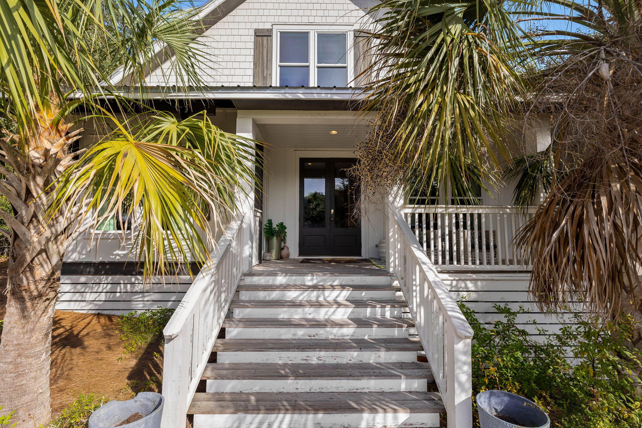 Presenting an iconic piece of Blue Mountain Beach history, where timeless Southern charm meets the refined simplicity of modern coastal living. Originally constructed in 1925 and meticulously transported from Andalusia, Alabama, this 4-bedroom, 4.5-bathroom cottage-style residence has become a cherished landmark in the area, undergoing a comprehensive restoration in 2016 that thoughtfully preserved its character while embracing contemporary comforts.This home exudes authenticity, from its heavy timber framing to its rich, storied past, embodying craftsmanship in every detail. The classic cottage design is seamlessly enhanced with modern updates, including a fortified new foundation, high-impact windows, and updated electrical and plumbing systems. Inside, Pecky Cypress beams, shiplap walls, and side-sewn pine floors set a relaxed, coastal ambiance, while the open floor plan offers both space and intimacy, ideal for gatherings or serene retreats. The main level features a luxurious primary suite with a marble-tiled bathroom, along with an inviting guest suite, while the upper level hosts two spacious ensuite bedrooms.

Nestled on a generously sized lot, the home is within walking distance to the breathtaking beaches along 30A and just a mile from the vibrant Gulf Place community. A short stroll or golf cart ride brings you to beach access, eclectic shops, local dining, and events, as well as the scenic Longleaf Greenway trailhead, perfect for biking and hiking adventures.

Currently on a short term rental program and offered fully furnished with designer lighting and custom window treatments, this residence is truly move-in ready. Experience the luxury of space with rare privacy on a large lot and no HOA, all while savoring the heart of Blue Mountain Beach. Embrace the coastal lifestyle in a home where every detail reflects history, character, and coastal elegance.