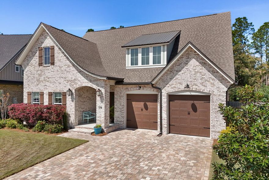 Faith, family, and peace. Those three things are what 174 Revana Way and the sweet family that custom-built it are all about, and you can feel it throughout the design. My favorite feature is how peaceful I feel in the privacy of the backyard as I listen to the wind rustle the leaves in the trees. Sitting on the 20'x10' screened-in porch is so quiet and tranquil, it looks out across the garden at the permanently preserved nature that borders the backyard. It makes me feel tucked far away despite being in one of the nicest subdivisions in Freeport. I love how large the family room and kitchen feel, they're placed at the center of the floor plan making them the heart of the home, both physically and metaphorically. Every aspect of this home was chosen with intention. The owners incorporated a real wood burning fireplace in the family room, and they've told me how special it is to sit by the crackling fire on a crisp Autumn night watching college football. They custom designed their walk-in pantry with unique shelving layouts that I haven't seen anywhere else. The sellers put a lot of care into maximizing the utilitarian spaces with additions like the custom walk-in pantry, walk-in laundry room with built-in hanging racks and sink, extra large kitchen island with barstool seating, and a large attic above the garage. The home was also laid out on a single level so there's no need to navigate stairs.

What also stands out about 174 Revana Way is the quality. I'm the son of a builder, so I have high expectations in that regard, and this home meets my standards. It's a Randy Wise built home. He has a great reputation, and I'd gladly let Randy and his team build my personal house. This property has beautiful curb appeal with its curated landscaping, brick masonry, and cobblestone pavers. It also has stellar finishes like 10' ceilings throughout the home, stainless steel & natural gas appliances, and epoxy flooring in the garage. 

Upon entering the house I'm immediately struck by two things: the 10' ceilings throughout which make the floor plan feel larger, and the brick archway that greets you at the foyer, an elegant flourish that speaks to the quality of the home. The layout is designed so that there's a guest wing off the foyer that houses the two guest bedrooms with their jack-and-jill full bath. There's also a large closet for storage in the hall. The family room and kitchen serve as the heart of the home, and the master suite is positioned just off them. There's also a separate wing off the kitchen with the sizable home office, walk-in laundry room, and entrance to the two-car garage. I appreciate that the sellers chose to position the laundry next to the garage door, it makes it easy to keep the house clean and not track messes inside.

The master bedroom has a walk-in California closet with floor-to-ceiling built-in shelving. The ensuite bathroom has separate his-and-hers style vanities along with a freestanding tub and a walk-in shower. The shower has built-in bench seating, two separately controlled shower heads, and an adjustable spray attachment with its own temperature control. 

174 Revana Way is located in The Vineyards at Hammock Bay, a gated subdivision known for being one of the nicest communities in Hammock Bay. The Vineyards is located less than 0.5mi from premium amenities such as pickleball courts, heated pools, a lap pool, basketball court, tennis courts, playground, Hammock Bay General Store, Props Brewery, an assortment of food trucks, and more. It's one of the most sought after communities in all of Freeport, and it's also less than 30 minutes from a public beach access.