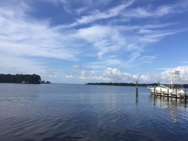 Large waterfront lot situated on Rocky Bayou - 3/4 acre with 150 feet of waterfront!! Lot faces South/South West. Expansive view of Rocky Bayou, Bluewater Bay area and across Choctawhatchee Bay towards San Destin. Open water (no bridges) all the way to Destin Bridge. Deep water for larger watercraft. Sloping lot provides higher building elevation with enhanced view and storm surge protection. Lot is on quiet cul de sac. Close to everything: Eglin AFB, schools, churches, shopping, and recreation. Easy to see. Just drive up and walk down to the water thru tall and stately pine trees. Boundary Survey and Elevation Certificate available.
