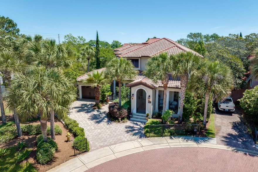 Welcome to 3 Rue Martine, a custom-built home nestled on a cul-de-sac within the prestigious Neighborhood of Caribe in Miramar Beach, FL. This beautiful residence combines sophistication and warmth, creating the perfect retreat for both everyday living and entertaining. As you step inside, you'll immediately notice the fine craftsmanship, from the beautiful millwork to the rounded corners and tall baseboards. Natural light floods the open-concept living and dining areas, where plantation shutters and a well-appointed wet bar set the stage for memorable gatherings. The gourmet kitchen, featuring high-end GE Monogram appliances and a large pantry, is a chef's delight, while the first-floor master bedroom offers a private sanctuary with ample storage and a luxurious en-suite bathroom.