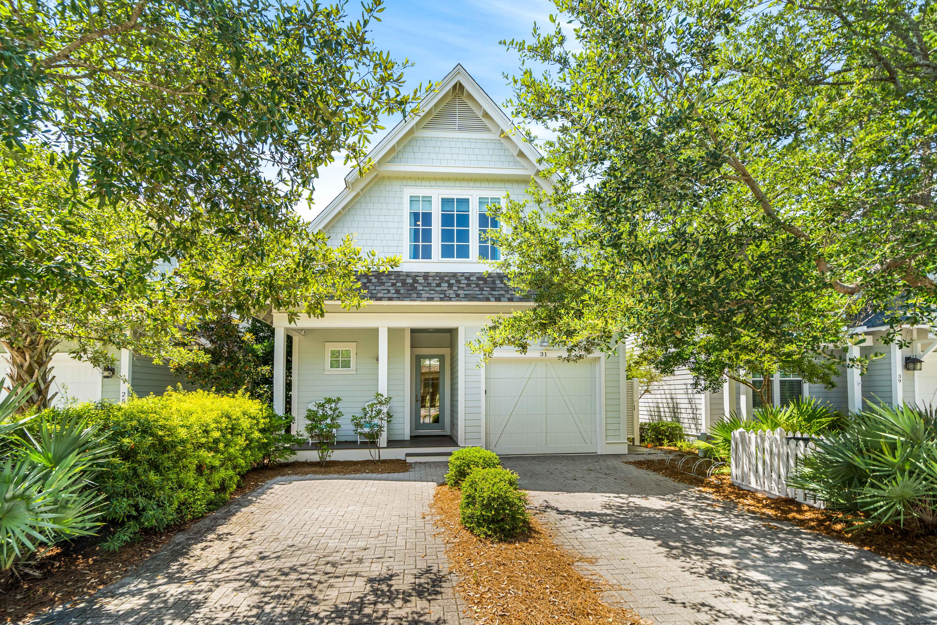 WELCOME HOME to your idyllic beach cottage located south of Scenic Hwy. 30-A in the most desirable community of Watersound West Beach.  From the moment that you enter the sunny inviting home, you will feel serene. Warm hardwood floors throughout for easy coastal living.  Open living area with chef's delight kitchen complete with beautiful 88x40 marble kitchen island & counters, glass backsplash with soothing ocean hues, Wolf gas stove & more. Flowing into a cozy dining and spacious living area for all to gather making memories of fun beach times, with conveniently located bar with wine refrigerator.Step out to outdoor living at its finest with relaxing screened porch. Your boardwalk leads to a scenic walk to the emerald waters and sugar white sands and to the large community pool.