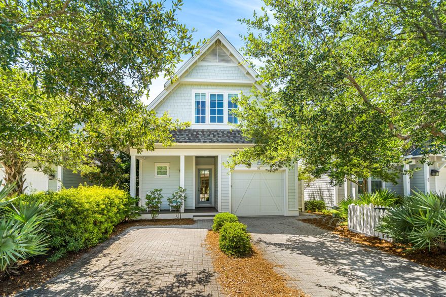 WELCOME HOME to your idyllic beach cottage located south of Scenic Hwy. 30-A in the most desirable community of Watersound West Beach.  From the moment that you enter the sunny inviting home, you will feel serene. Warm hardwood floors throughout for easy coastal living.  Open living area with chef's delight kitchen complete with beautiful 88x40 marble kitchen island & counters, glass backsplash with soothing ocean hues, Wolf gas stove & more. Flowing into a cozy dining and spacious living area for all to gather making memories of fun beach times, with conveniently located bar with wine refrigerator.Step out to outdoor living at its finest with relaxing screened porch. Your boardwalk leads to a scenic walk to the emerald waters and sugar white sands and to the large community pool.
