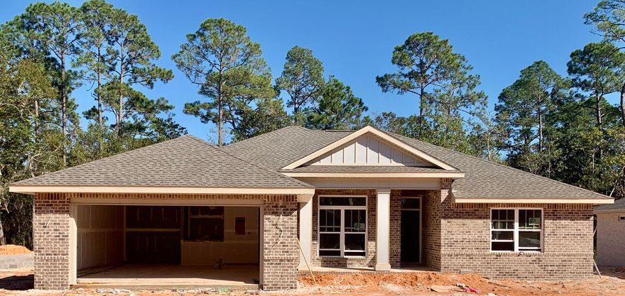 One of 5 NEW CRAFTSMAN Custom Built Homes under construction in West Navarre nestled on a tree lined no through road .This luxurious 4 bed/3 bath split floor plan is under construction...and will be ready in time for your  early 2022 move in  ~easy access to Navarre Beach,Navarre Waterfront Park and Hwy 98 to Hurlburt Field AFB.This Stunning Robbins Builders Custom Home offers trend setting Features~Greeted by a walk in foyer sweeping through to your open floor plan~Large kitchen enjoying Shaker cabinets with crown molding,beautiful GRANITE counter tops~Under mount sink~S/S appliances ~Center Island with sleek top breakfast bar ,offering an open flow to the dining area and large family room, Gorgeous LVP throughout. Master bedroom with trey ceiling & ceiling fan~ Large Master bathroom boasts plenty of dressing area with his and her closets ~ oversized TILED walk in shower with seamless glass door~Granite vanities with rectangular under mount sinks ~picture frame mirrors and separated by a large linen closet all beautifully complimented by Brushed nickel fittings. Additional bedrooms are a great size with either a double or walk in closet and ceiling fans~Additional bathroom has a granite vanity with a tub/shower and adjacent linen closet.All this and home still offers a large office/play room off the main family room. Home has a welcoming covered front porch and large covered back porch to sit out and enjoy those wonderful Florida evening ~great to cook out and entertain.Large lot offers a East facing back yard to enjoy the Florida sunrise and shaded evenings ~ Irrigation well and timed sprinkler system for easy care~ Hurricane protection for windows and dimensional shingle roof for lower insurance premium. Upgrades throughout include crown molding, recessed lighting , deluxe lighting package,50 Gallon water heater, garage door remotes, attic drop down stairs~ to name a few....Call today for further information