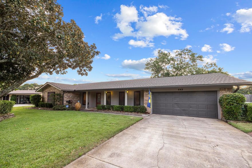 Seller offering 5,000 in concessions. Welcome to 649 Overbrook Drive, a beautifully updated home nestled in the well-established Fort Walton Beach neighborhood of Overbrook with mature trees and sidewalks. Centrally located to both Hurlburt Field and Eglin AFB, this is an ideal location for Active Duty and DOD personnel. Fort Walton Beach is rich in activities and scenery such as public parks and recreation, emerald water beaches on Okaloosa Island and nightlife in downtown Ft. Walton Beach. With many shopping and dining options nearby, there's something for everyone. This 4-bedroom, 2-bathroom residence features a new roof (August 2024), HVAC system (2020), and water heater (2018) offering peace of mind and efficiency. Inside, you'll love the vinyl plank flooring throughout and the abundance of natural light pouring in through large vertical dining windows and multiple expansive living room windows. The open-concept layout seamlessly connects the living area to a thoughtfully designed kitchen boasting floor-to-ceiling honey oak cabinetry, including pantry space, granite countertops, a kitchen island with bar seating, stainless steel appliances, and a deep white enamel dual-basin sink. The primary suite is generously sized and features dual closets, while the en-suite bath is a standout with custom tile work, cabinetry, and a sleek glass tile shower. Step outside to enjoy the expansive, privacy-fenced backyard, complete with a covered lanai, extended paver patio, exterior storage room, and a sprinkler system with lawn pump. The covered front porch adds even more charm to this inviting property. Don't miss your opportunity to own this move-in ready gem!