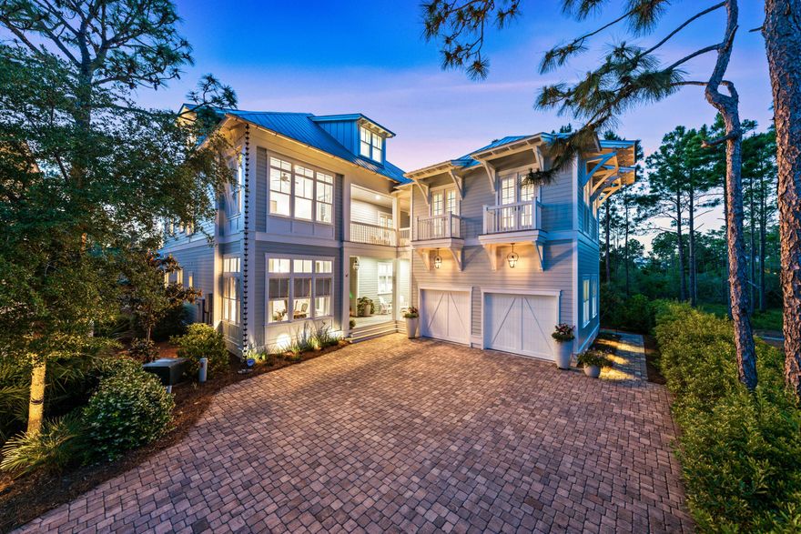 Thoughtfully designed and meticulously crafted, this stunning home at 667 E. Royal Fern Way sits on one of the most private lots in Watercolor, the premier planned community on 30A. Perfectly positioned to take advantage of common ground on three sides, a native forest provides the ideal backdrop for outdoor living. The chef's kitchen features premium Wolf and Subzero appliances, an oversized island ideal for food prep, serving, or casual dining, and a spacious walk-in pantry. Both the center entrance hall and kitchen flow seamlessly into the living and dining rooms that are each anchored by a fireplaces. Adjacent to the kitchen, the laundry room includes an office and convenient exterior access to both the rear and front porches. With its sitting, dining, and grilling areas, the screened porch is perfect for alfresco dining and entertaining. It opens onto a breathtaking pool deck, complete with a heated pool that boasts a waterfall and gas fire bowls. A cozy sitting area, enhanced by a fireplace is the ultimate spot for relaxation. The first-floor primary bedroom is a luxurious retreat with walk-in closets, a generously sized bathroom and a French door that lead directly onto the pool deck. The climate-controlled wine storage and tasting room is a standout feature, designed to accommodate more than 1,500 bottles with space for tasting experiences. There is a private office and a full bathroom off the front entrance hall. The second floor is equally impressive, boasting three ensuite bedrooms, and a family room with a coffee bar, perfect for entertaining or unwinding. A second-floor carriage house provides additional private living space for guests. The third floor offers versatility with a spacious bonus room and an additional bedroom. All floors of the home are accessible by either the central staircase or a convenient elevator. Every detail of this home, from the warm wood flooring to the special upgraded finishes, enhances its ambiance and timeless sophistication. This distinctive home blends elegance and functionality to create an extraordinary living experience. When not immersed in the privacy of the home, take advantage of the many amenities Watercolor has to offer. Visit the beach club, one of four neighborhood pools or the town center with it shops, cafes and restaurants.  Offered furnished with some exclusions. Buyers to verify all information and dimensions.  