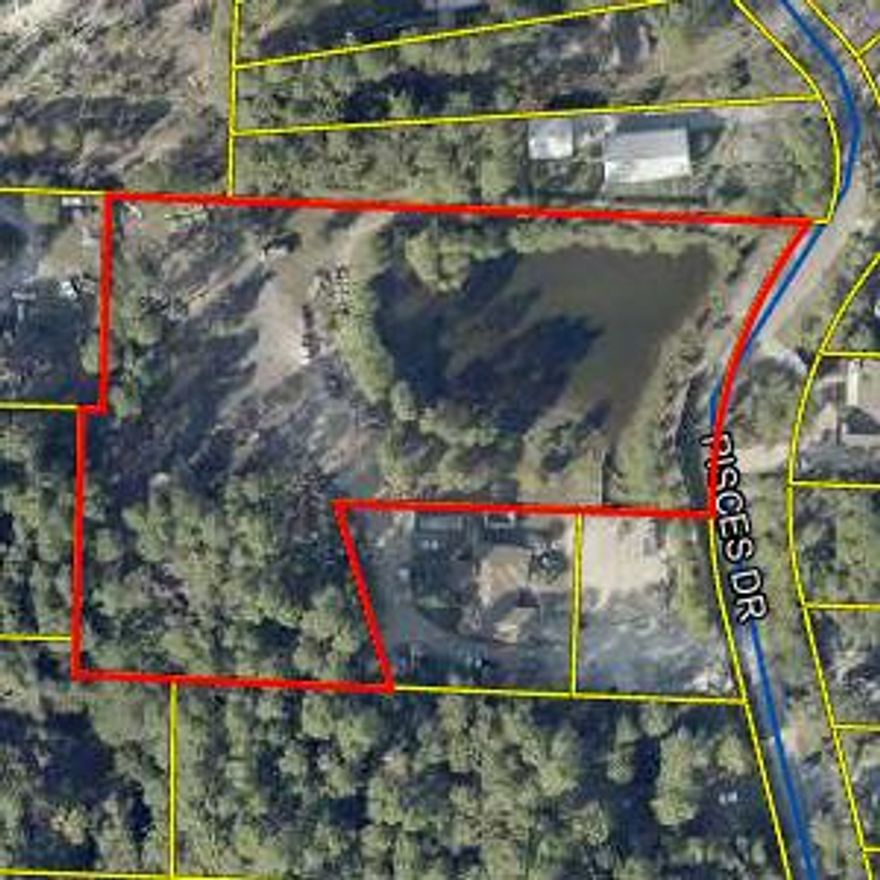 Prime 1.74-acre parcel located on Pisces Drive just north of Chat Holley, offering excellent potential for residential development or a private homesite. The property features a scenic pond and a peaceful natural setting while still being conveniently located near local amenities, schools, and beaches. Zoned to allow up to 4 units per acre, this parcel provides the opportunity to develop up to 6 homes or create a spacious estate-sized property with plenty of room for privacy. The land offers a beautiful backdrop for new construction with the added appeal of water views. Ideal for builders, investors, or buyers looking to build a custom home in a growing area of Santa Rosa County.