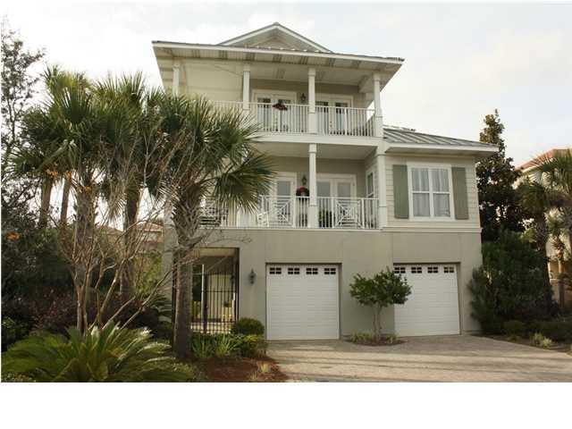 SHORT SALE SUBJECT TO LENDER APPROVAL! It's just a short stroll to the beach from this beautiful custom built home in the desirable gated neighborhood of Destiny! Designed with an eye for detail, this is a must see! Great curb appeal, with views of the lake and a peek of the Gulf! The first level has a large welcoming foyer, great under the stairs storage, access to an oversized two car garage, and the guest/in-law suite. The suite has a living area, kitchen with full sized refrigerator, two eye cooktop, dishwasher, sink and plenty of cabinet storage, sleeping area, full bath, walk-in closet with a stackable washer and dryer, a patio to the rear and an additional private entrance. On the second level is the great room featuring hardwood floors,