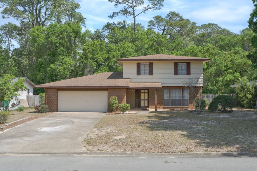 Investor opportunity in the highly-desired south Niceville area. Spacious quarter-acre, lot that backs to Niceville's local 3-acre nursery, with plenty of trees and privacy directly behind the property. Several houses on the street have recently undergone full renovations. Large laundry room with door to backyard and garage. Stainless steel dishwasher and oven. Formal dining and two living areas on first floor, with potential to redesign floor plan. Extra-wide two-car garage with plenty of storage on both sides.