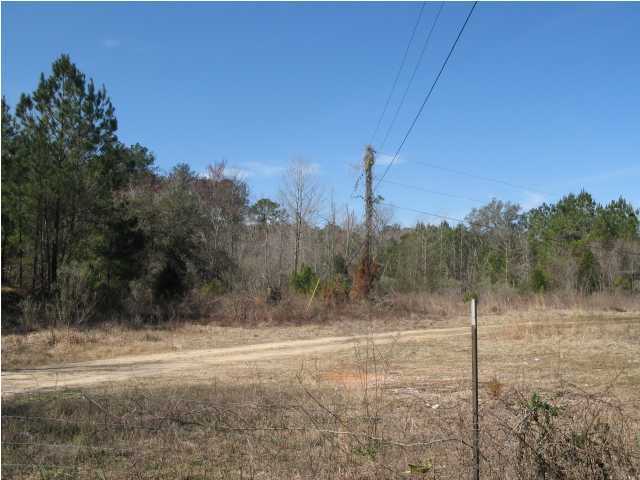 22 acres located at the S.W. corner of I-10 and Hwy. 279 south of Caryville, FL. Land is wooded and some area cleared. Rear of property backs up to the N.W. Water Management District property that borders the Choctawhatchee River. Has some wetlands. Zoned Commercial. Would make a great RV park.
