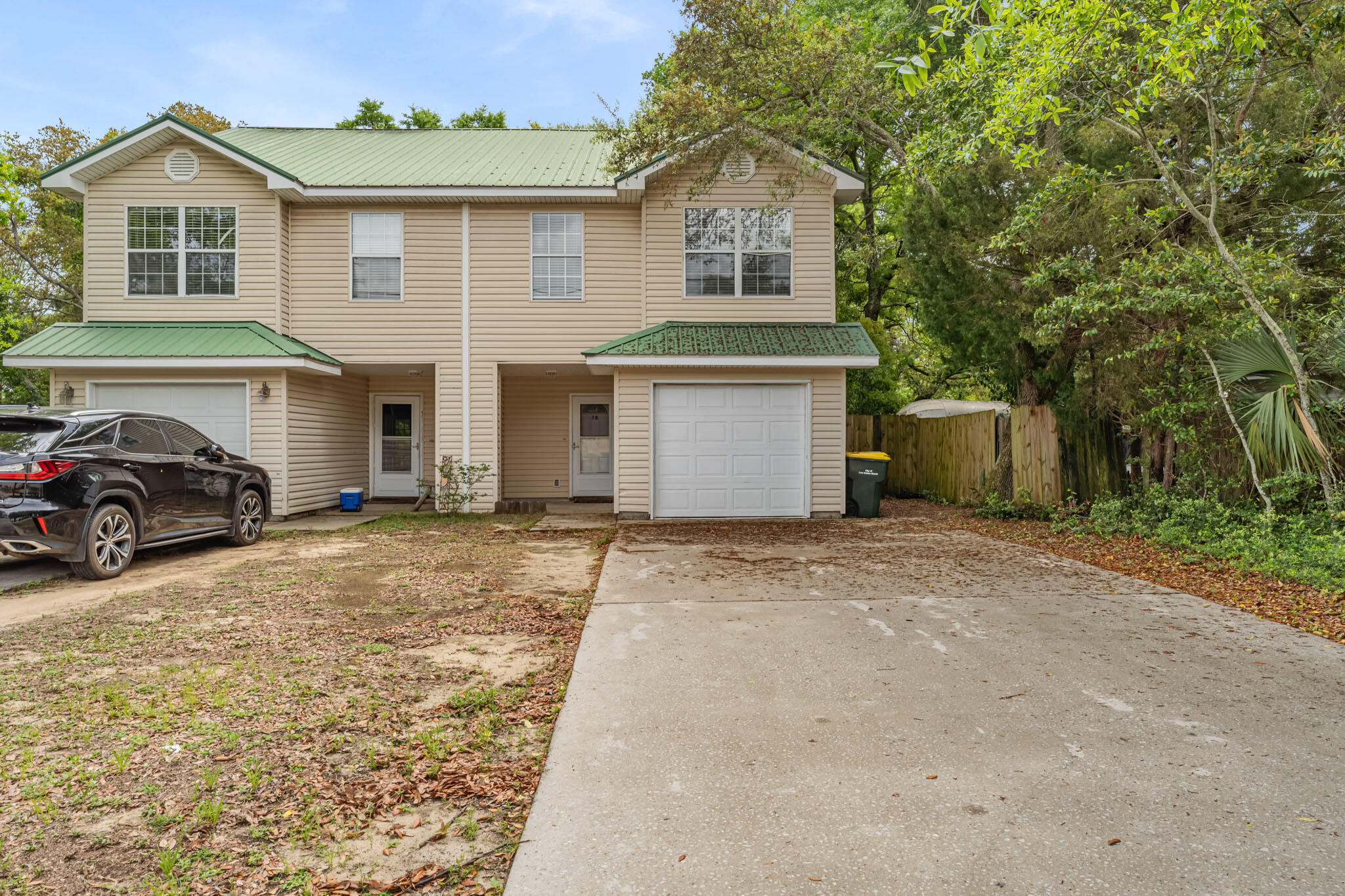 Charming 3 bed, 2 1/2 bath townhome with 1 car garage, metal roof, and ample fenced-in back yard. Tile flooring throughout the first floor and carpet in the bedrooms and stairs. This home offers a large primary bedroom that features a walk-in closet and an ensuite with double vanity. There are 2 extra bedrooms and a full bath upstairs. There is a convenient laundry closet in the unit and the French doors in the main living space lead to the spacious backyard ready for summer bonfires. .