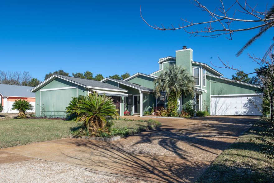 IINVESTORS DREAM...GREAT RENTAL... Private P00l.... IDEAL LOCATION...NO HOA FEES-Once two townhomes, this versatile property has now been converted to a single-family home on a fantastic lot that's so close to the Gulf you can hear the rolling surf and has a large front yard with driveway parking for 8 vehicles plus golf carts. Large private fenced backyard with patios and a private gunite pool that was recently resurfaced. The home is currently a single-family, 4 bedroom/ 3.5 bath, plus a huge bonus room that could be a 5th bedroom, second den, or a large bunk room. It has a brand New Roof, two-car garage with laundry connections, separate interior laundry room, and two HVAC units. Upgrades include recently installed driftwood-look tile flooring, recent connection to county sewer so