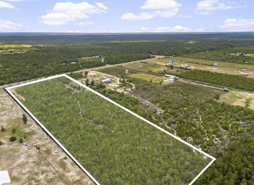 Discover the endless possibilities with this 10-acre parcel of raw, wooded land located directly off a paved road. Whether you're looking to build your dream home or create a private retreat this property offers a rare opportunity with natural beauty and unbeatable access. Just 2.8 miles from Econfina Creek, it's a nature lover's paradise--perfect for kayaking, fishing, and outdoor adventures. You're also just 31 miles to Panama City Beach, 19 miles to Lynn Haven, and 30 miles to Tyndall Air Force Base, making this the ideal blend of seclusion and convenience. This land is currently uncleared, giving you the freedom to shape it to your vision. It can also be sold in conjunction with the neighboring property at 7416 FL-20, Youngstown, FL 32466, for expanded possibilities.