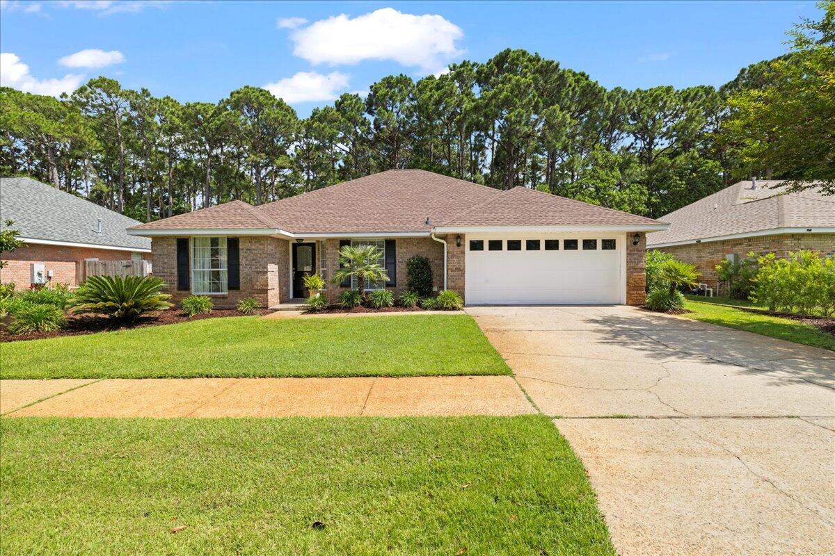 Beautifully renovated 4BR/2BA home in sought-after Indian Woods, Destin! This move-in ready gem backs up to a serene natural preserve for added privacy. Enjoy fresh paint throughout, a brand-new A/C and hot water heater, and stylish updates inside and out. The spacious living room features soaring cathedral ceilings, creating an open, airy feel. Conveniently located near beaches, dining, and shopping! A rare opportunity in a prime location!