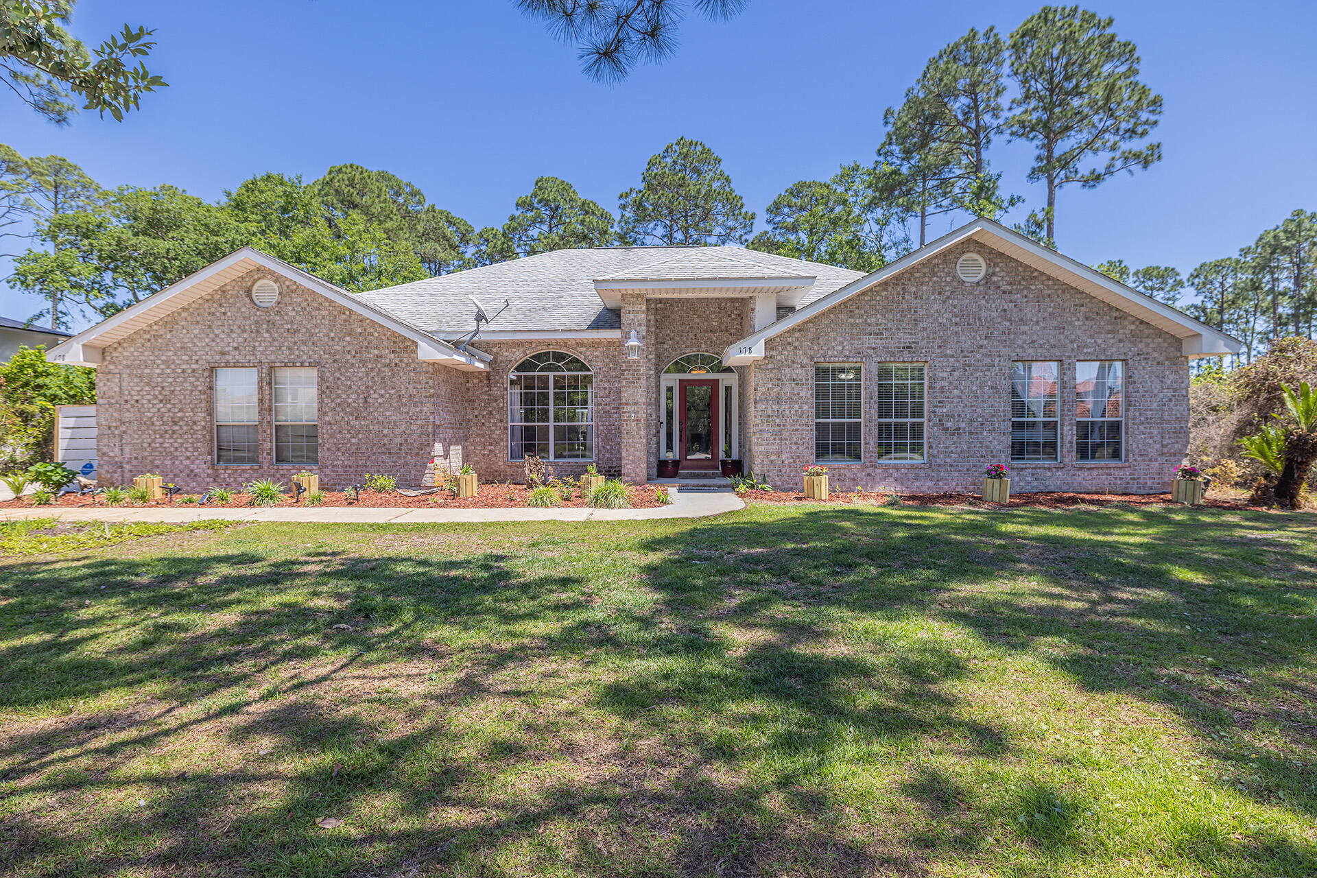 Solar Panels...PAID OFF!!!! Enjoy life near the bay with a low utility bill and an in ground pool.  Enjoy the peaceful feel of indoor/outdoor living in this beautiful 4 bedroom, 3 bath home with a screened in heated 15'x32' pool on .83 acres in Driftwood Estates while being close to the beaches of 30a and shopping at Grande Blvd. Driftwood Estates includes a county park with a playground, pickle-ball/tennis courts, covered pavilions, baseball/soccer fields, and basketball courts.In addition to the paid off solar panels the home includes an outdoor gas hook up on the patio to add an outdoor grill, kitchen, or gas fire pit. There is also surround sound with Bose speakers throughout the house that is also wired and connected to the outdoor pool area.