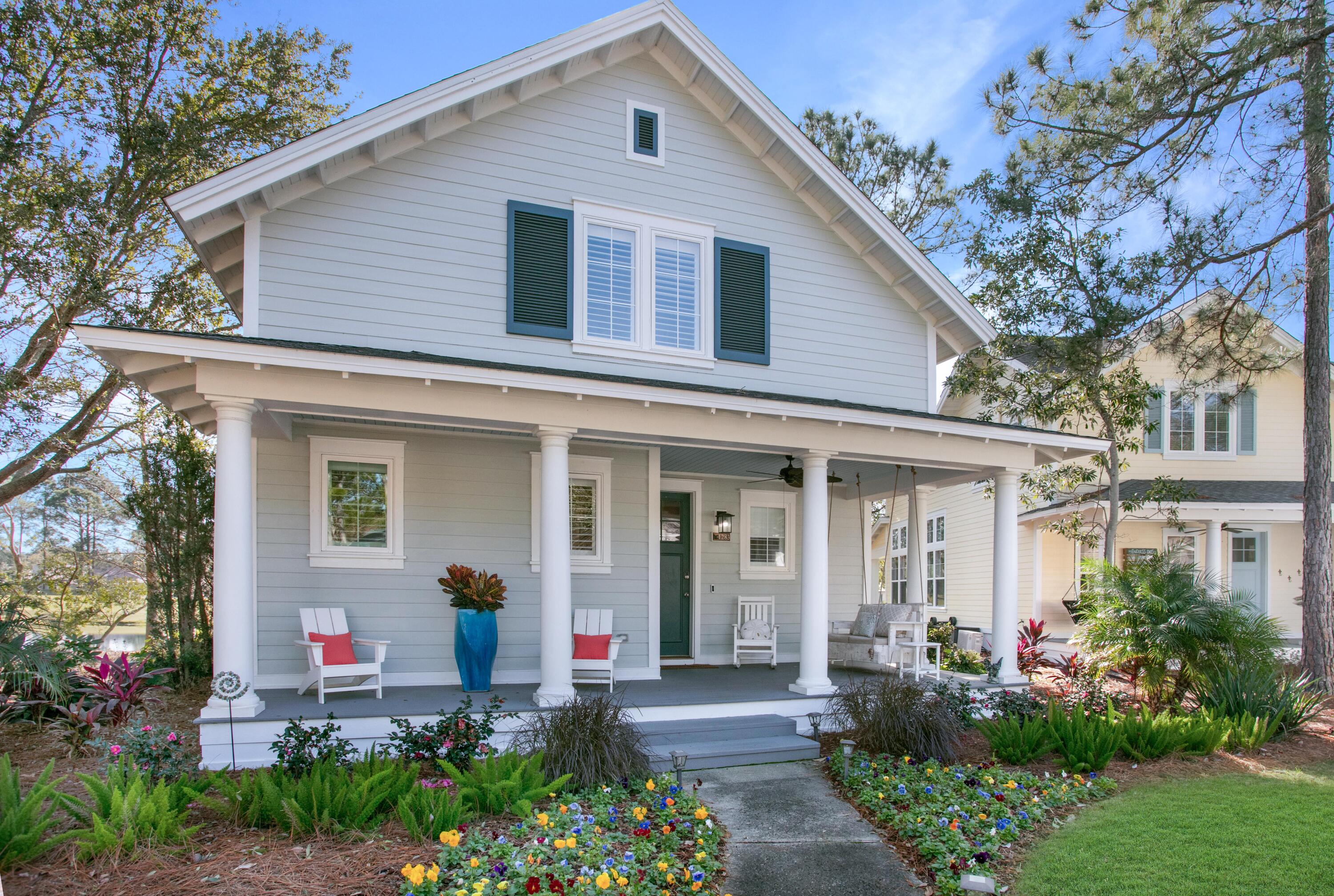 Introducing a renovated Laurel Grove cottage nestled along the 18th fairway of Raven Golf with tranquil lake and golf course views. Impeccably upgraded within the last 2 years, this residence boasts a brand-new roof with energy-efficient insulation, a freshly painted exterior, and a redesigned front facade. Enjoy the lush landscaping and unwind on the screened back porch with a privacy shade. Inside, discover a haven of modern luxury with a new 2022 water heater, redesigned 1st floor primary bedroom and bath, plantation shutters, LVP flooring, newly painted cabinetry, updated fixtures and fans, stainless steel Bosch and Whirlpool kitchen appliances and a new washer/dryer combo. Every bedroom offers an oversized walk-in closet for ample storage or bunkroom.