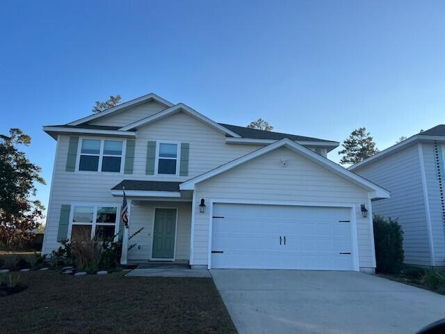 Located on a Cul-de-sac that backs up to a wooded area. Home is like new and is ready for occupancy!  This floor plan features 5 bedrooms with 2.5 baths, a two garage and spacious living area and downstairs bedroom. Standard features of this home include vinyl flooring throughout the common areas and plush carpet in bedrooms, shaker cabinets, laminate counter tops, stainless appliances in kitchen including stove microwave and dishwasher. Moen faucets and plumbing features, lighting package and a Smart Home package.