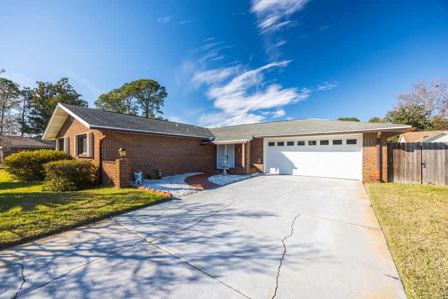 Step into this immaculately maintained 3-bed, 2-bath brick home in the heart of the sought-after Mary Esther Manor neighborhood. Nestled on a spacious 0.23-acre lot, this property combines timeless retro charm with modern conveniences. From the moment you enter, you'll be greeted by a warm and inviting atmosphere, featuring a formal dining room that can easily double as a home office or additional living space. The master bathroom boasts a luxurious walk-in shower, while the flowing floor plan ensures comfort and functionality throughout.Outside, you'll have added piece-of-mind and better insurance premiums thanks to a brand new roof being installed on February 10th! A screened back porch offers the perfect spot to enjoy your morning coffee or host friends on breezy Florida evenings. The expansive backyard, complete with a charming brick oven, is an outdoor entertainer's dream! Ideal for pizza nights, barbecues, or simply relaxing outdoors. With an oversized 2-car garage and ample parking, this home also provides plenty of space for vehicles, storage, and guests.

Located just minutes from shopping, dining, and the beach, this home also offers quick access to Hurlburt Field's back gate, making it a perfect location for convenience and commuting. The Mary Esther Manor neighborhood is enriched by a beautiful lake and a city-maintained park that includes a playground, picnic areas, grills, tennis courts, and a basketball court.

Don't miss the opportunity to own this gem that blends retro flair, modern updates, and an unbeatable location. Call today to schedule your private tour and make this Mary Esther dream home yours!
