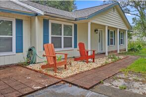 3 bed / 2 bath and a large Florida room has an attached in law suite with 1 bed / 1 bath, dining and kitchen area with front and back access and it's own driveway! Can use access into house if choose to do so as well! Walking distance to stores, restaurants, pharmacy and the sound. Public boat ramp across the street and a few minutes drive to the beach. This is a must see home in a great location! Contact Navarre Beach Realty at 850-936-0700 to schedule a viewing.