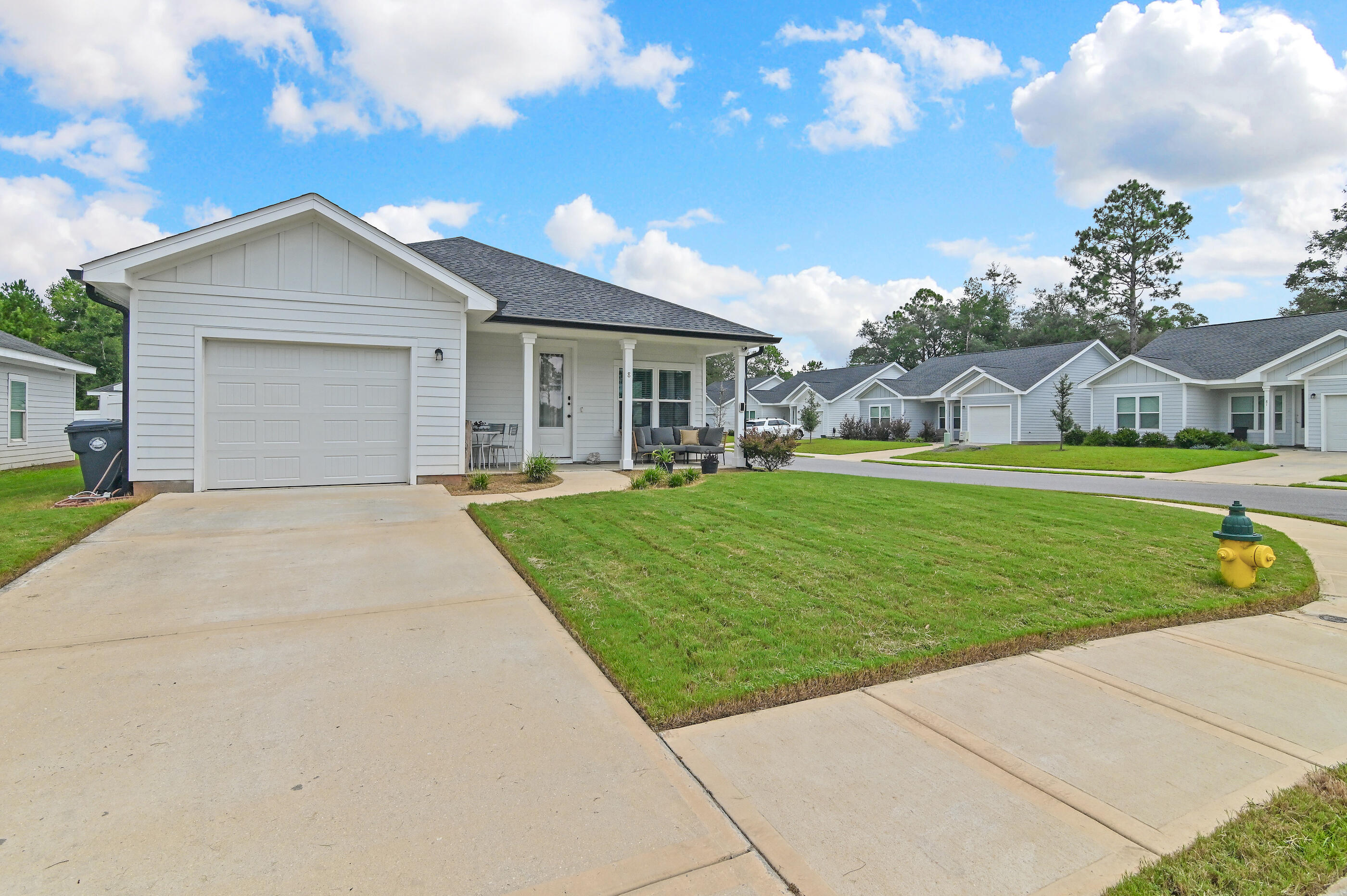 This beautiful home, The Plumeria Retreat, 3BR/2BA home in Freeport offers comfort, style & convenience. Built in 2022, the Retreat floor plan features 1,278 sq. ft. plus garage. Enjoy quartz countertops, stainless steel appliances, luxury vinyl flooring & a walk-in tiled shower in the primary suite. The open layout is perfect for entertaining, while private bedrooms provide space to unwind. One of the largest floor plans in The Enclave, this home boasts a fenced yard with its own Plumeria tree. Close to shopping & just a short drive to 30A & Destin beaches.