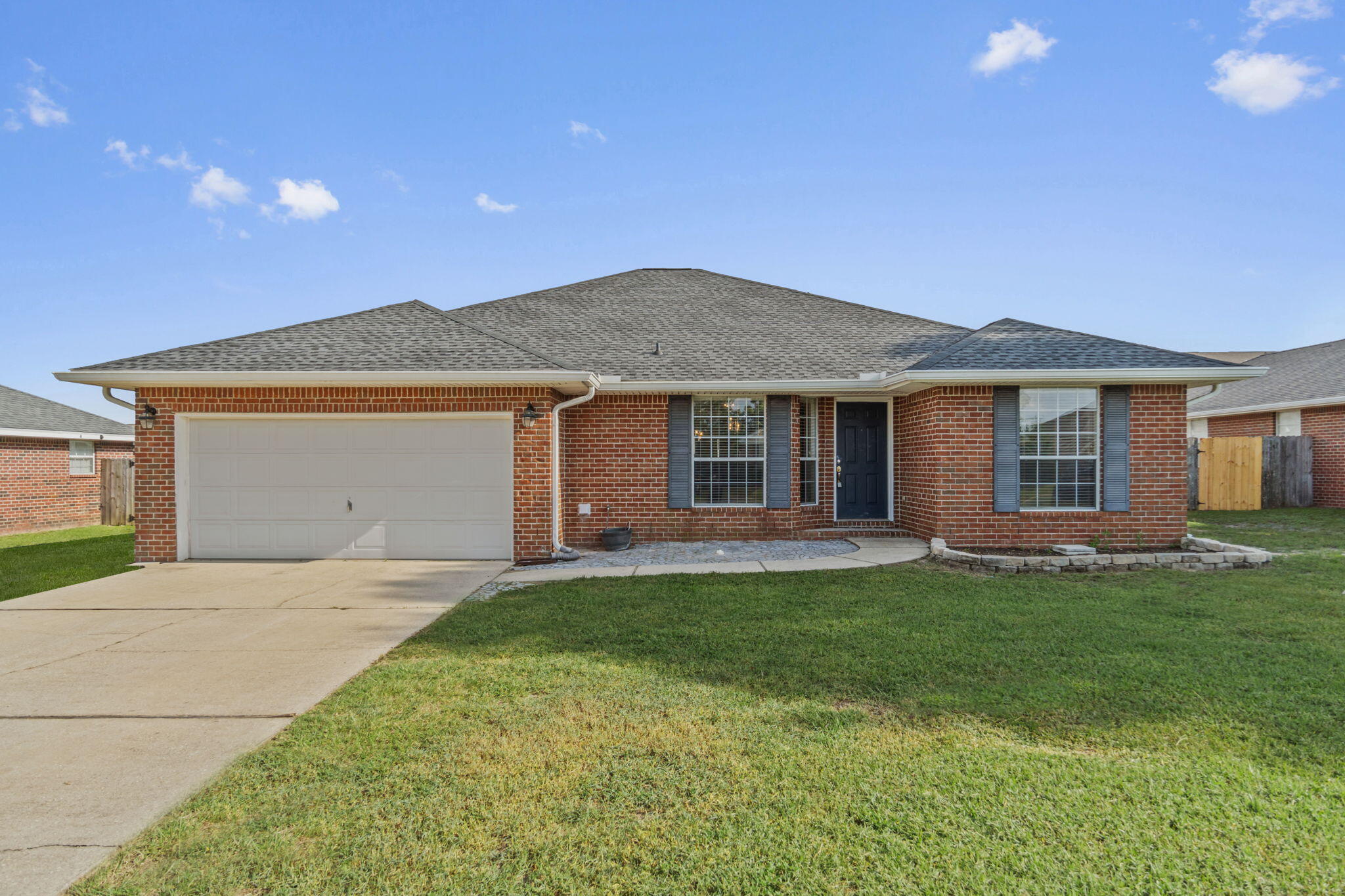 Behold the charm and comfort of your new home at 203 Citadel Lane in the heart of Crestview, FL. This splendid 1,928 sq ft property offers an abundance of space with four spacious bedrooms, perfectly designed for relaxation and peace. With two full bathrooms, you'll never experience the morning rush again. Imagine the joy of creating culinary delights in a kitchen that flows seamlessly into the living spaces, ideal for entertaining and everyday living. Natural light floods the home, creating a warm and inviting atmosphere throughout. The open layout ensures that every corner of this home is both functional and stylish