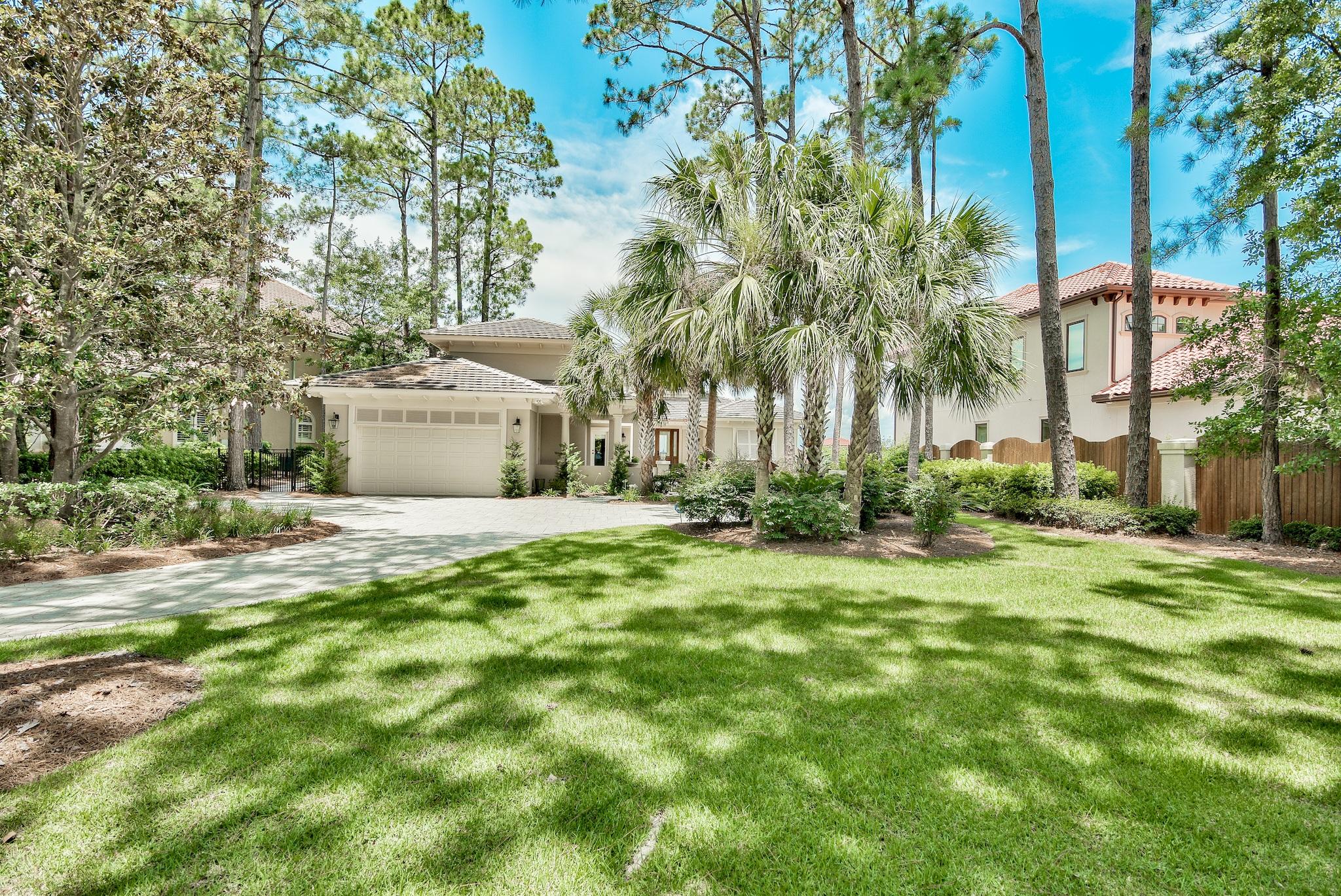 Lush landscaping welcomes you to this lavish Bayfront home in Bay Villas. You are first greeted with a privacy gate into the stunning courtyard with separate access to guest accommodations. The entrance and foyer area of this unique home provides for a welcoming experience and feel with its high ceilings. Convenient electric curtain controls present you with the awesome west facing bay views of the Choctawhatchee Bay and the formal living area with fireplace boasts high ceilings with floor-to-ceiling windows bringing in the natural light from above. The adjacent dining room with wet bar leads to an open kitchen and informal living room with access to the front courtyard. The kitchen offers light and storage space and with a convenient work island. The master bedroom has his and hers custom