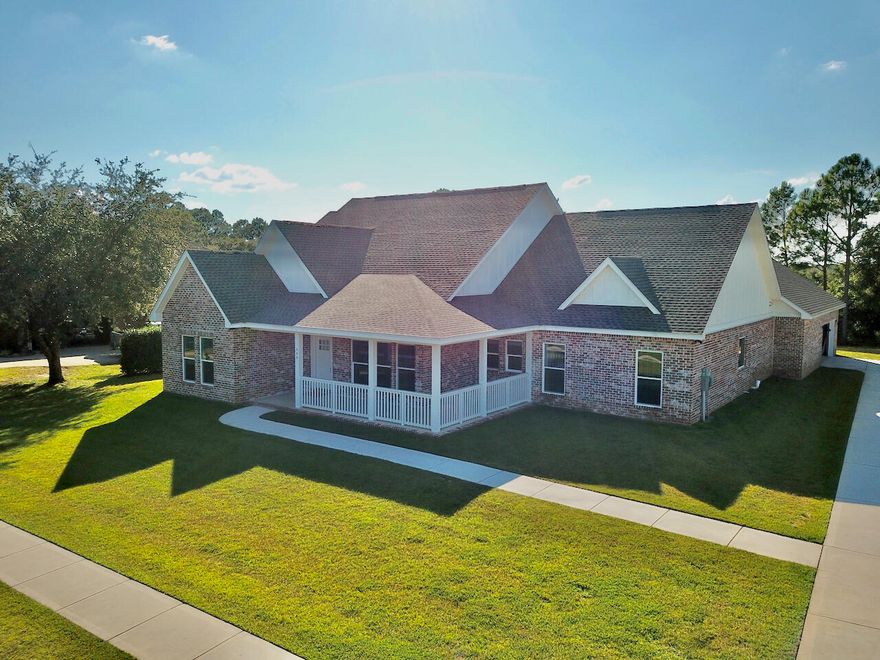 Welcome to 335 Club House Dr in the prestigious Windswept Estates golf community. This 2 year old custom built home is immaculate. With stunning curb appeal, and a manicured lawn, the home is extremely inviting. A spacious open floor plan with plenty of natural light, is great for entertaining, or just right for family time. The main areas of the home have LVP floor coverings, tile in the bathrooms, and carpeted bedrooms. The kitchen features all stainless appliances, with granite countertops. The master suite has a raised ceiling and a brick accent wall. Step into the master bath to find a separate soaker tub and shower. The home features a golf swing simulator room that has a separate mini split hvac. Step outside onto the expansive brick paver pool area to have amazing west facing sunset views. 
