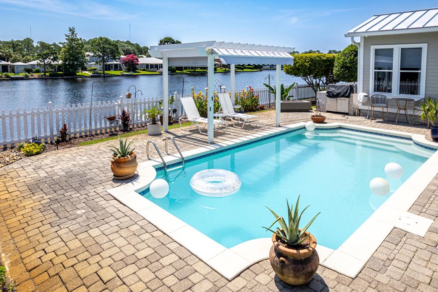 Located in the picturesque community of Crystal Lake, this freshly painted and updated lakefront retreat features a rare double car garage, oversized pavered driveway, and a private dock perfect for kayaking and fishing. Enjoy a refreshing pool with a new pump and an expansive outdoor living area complete with a newly added screened porch, pergola, and grilling station. Inside, the updated kitchen showcases quartz countertops, elevated appliances, custom pull-out shelving, and soft-close drawers. The spacious primary suite is on the first floor, offering lake views, a remodeled ensuite bath, and private access to the screened porch. A flexible second bedroom on the main level features its own ensuite bath, wet bar, and porch access, perfect for guests, home office or extra sitting room. Upstairs, find two guest bedrooms, a shared full bath, and a walk-in attic with freezer.
Additional highlights include: 2024 HVACs (both units), 2020 water heater. Multiple walk-in closets, Built-in overhead garage storage with an electric access ladder, and Two-way blinds throughout.
This home offers the perfect mix of functionality, comfort, and lakeside living. Sandestin Golf and Beach Resort features more than seven miles of beaches and pristine bay front, four championship golf courses, 15 world-class tennis courts, a 226-slip marina, a fitness center, spa and celebrity chef dining. Shop, dine and play at the charming pedestrian village, The Village of Baytowne Wharf and more. Inside the gates of the resort, residents enjoy a balanced lifestyle of high-class living, spanning the 2,400 acres from the beach to the bay. Everything within the gates of the resort is accessible by golf cart or bicycle. The entire resort is interconnected by miles of pedestrian, bike and golf cart paths that weave through groves of live oaks, meandering past natural lagoons, fountains, man-made lakes, and meticulously landscaped fairways.