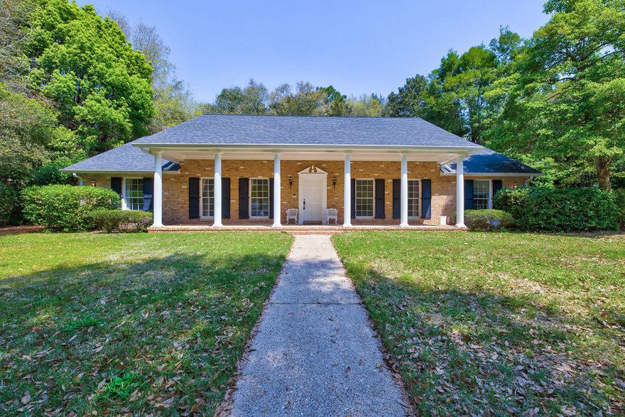 Gorgeous 3 bedroom, 2.5 bath, 2-story, brick home in the highly coveted Rocky Bayou Country Club Estates. You will love the front of this home with its grand columns and large covered front porch, the circular drive in front as well as the back, and that it is perfectly nestled up to the golf course green. Inside, on the first floor, there are two living rooms (one with a fireplace off of the kitchen and one to the right as you come in the front door), an office (with a door to garage), a formal dining room with a brand new light fixture, plenty of closets, a remodeled half guest bath, a spacious laundry/mud room, the oversized 2-car garage, a screened/covered back porch, brand new cabinetry with soft-close drawers and freshly installed granite counter tops in the eat-in kitchen (no