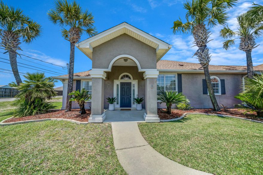 Call for details of seller's VA ASSUMABLE MORTGAGE! Welcome to this beautiful 5 bedroom, 2.5-bath home with private office, saltwater pool, ideally situated on a generous corner lot in the desirable community of Lynn Haven! This spacious home features numerous updates, including a new roof (2019), new HVAC system (2020), recessed lighting, new flooring, and fresh paint throughout. Additional improvements include gorgeous new walk-in master bath with 10' high walk-in closet. One of the highlights of this home is the 5 bedrooms, which offers a variety of living options for any family. Rooms can be used as a 2nd home office, gym, bonus room, craft room - the possibilities are endless to fit your lifestyle! The spacious design of this home is impressive. An open concept living and dining area provides the perfect space for entertaining family and friends, highlighted by a cozy gas fireplace. Just off the family room is access to the private office with a built-in granite desk and stylish sliding barn door. The kitchen is well-appointed with a gas stove, range hood, wine cooler, granite countertops. and a large pantry that includes a laundry area and direct access to the garage. The garage features a convenient half bath for pool use, a new water heater, and a dedicated workshop space. Step outside to your backyard oasis with newly upgraded saltwater pool with new heater and filter, lots of green space, and a screened-in porch area for relaxing and enjoyment. An additional feature is a double gated rear entrance to the backyard with a concrete pad for RV, boat, or camper parking. This home has a 24kw Whole Home Generac generator ensuring uninterrupted power supply (and a value of $13k!). With 38 solar panels significantly reducing energy costs, this home combines comfort, efficiency, and exceptional design in one outstanding package. Call today for your showing!