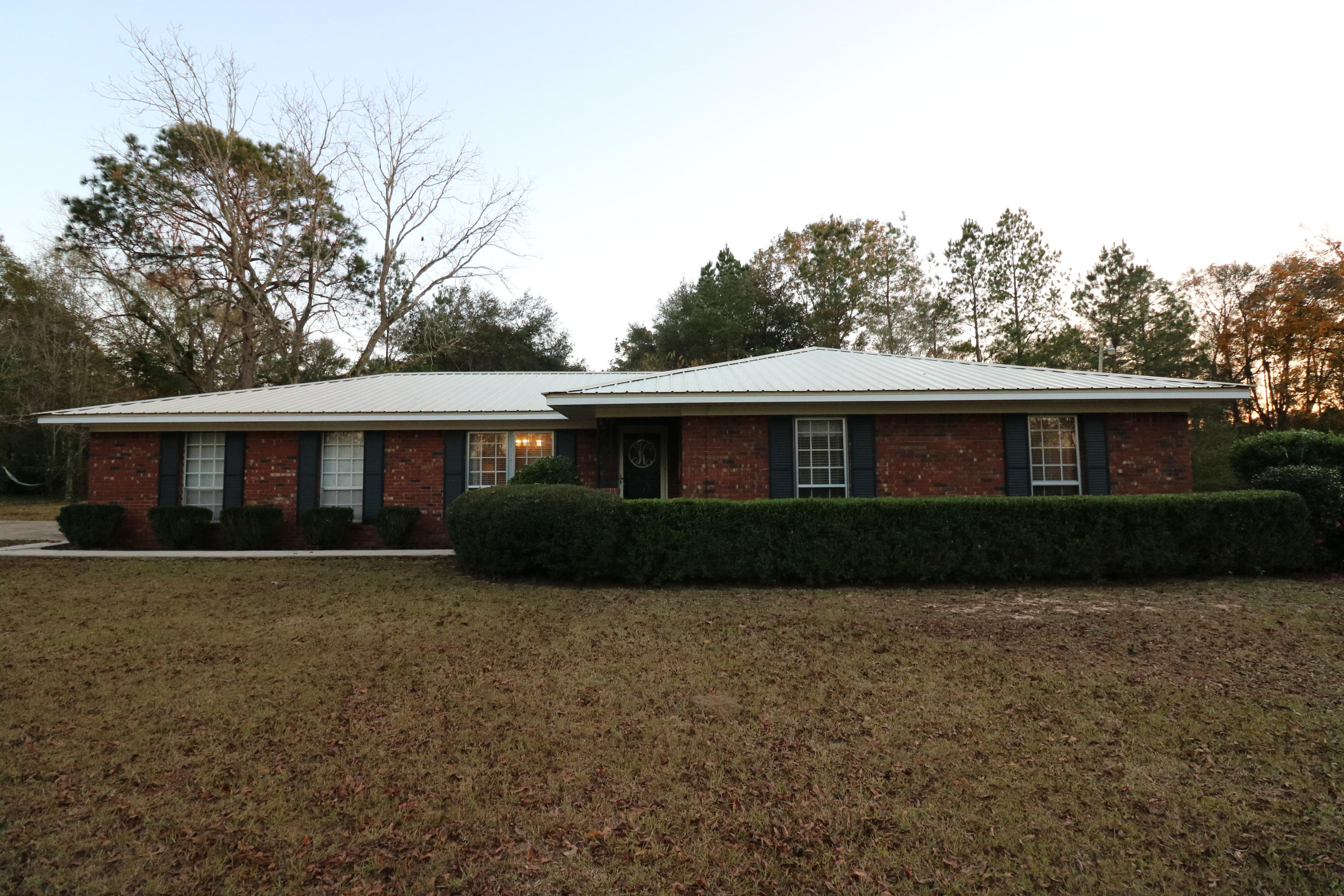 PRIME LOCATION!! Mockingbird Lane in Chipley off Falling Waters RDthis one's going to fly! 2 acres on the corner with a beautifully remodeled brick home. Follow the paved driveway to enter into this gorgeous move-in ready home with a newer metal roof. Take a look at the newly renovated kitchen with a pantry, wood-look laminate flooring (with padding), updated white cabinets, stainless steel appliances, and a roomy breakfast area. From there, cozy up to your large wood burning fireplace in the living room. As you walk into your new master bedroom you will realize you have a lot of space, full renovated bathroom, and a walk-in closet. You will love the over-sized laundry room, 2 car garage, and additional heated and cooled room in the garage to explore your crafts or music. Located within 2.5 miles to Falling Waters State Park and the tallest waterfall in Florida, 45 miles to the international airport, and 50 minutes to the sugar white beaches of Panama City Beach.