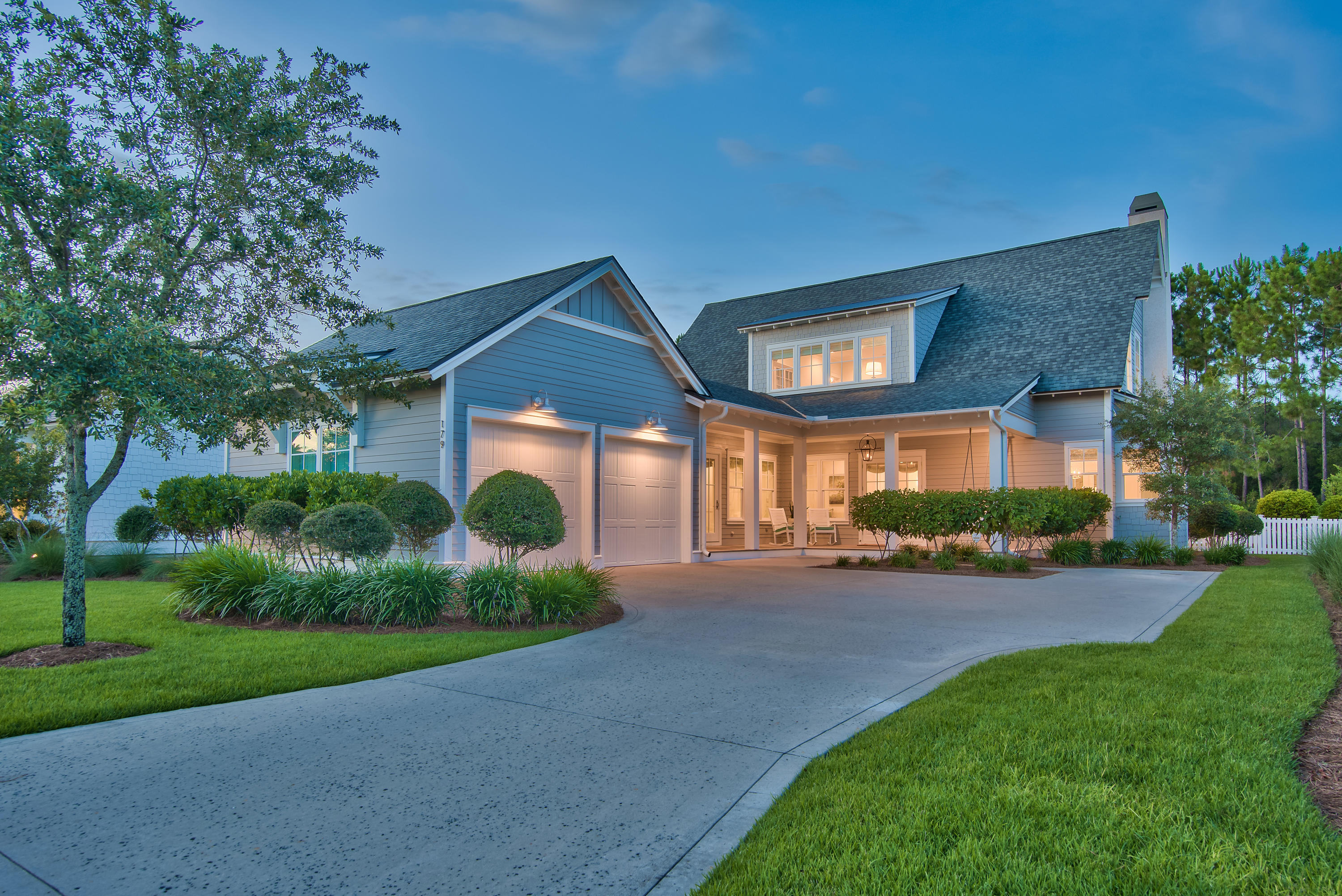 Experience the pinnacle of pure luxury with this beautifully crafted Jason Romair home in one of the best locations within Watersound Origins. This bespoke designer home has been meticulously curated with the finest finishes and is being offered completely furnished with professional decor inspired by light whites and hues of soft blue. The Cape-Cod design features its own private oasis including an oversized back yard, heated salt-water swimming pool & spa, and an outdoor fireplace/cabana that backs up to forever green space, creating the ultimate sense of privacy. Situated on the south side of Splash Drive, the ample spacing provided by this section of Watersound Origins is truly unique and quiet. 179 Splash Drive features 4 bedrooms with en-suite bathrooms, a bunk room, wrap