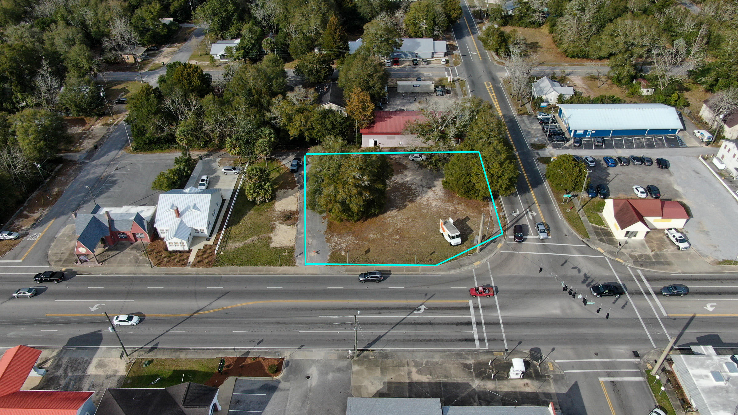 This busy commercial corner with a stoplight is located in the heart of downtown Defuniak Springs. Perfect spot to build a commercial business, Excellent visibility. High traffic. Meets all commercial requirements necessary for a successful commercial endeavor.