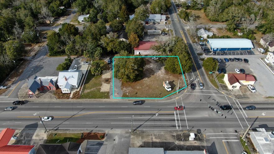 This busy commercial corner with a stoplight is located in the heart of downtown Defuniak Springs. Perfect spot to build a commercial business,  Excellent visibility.  High traffic.  Meets all commercial requirements necessary for a successful commercial  endeavor.