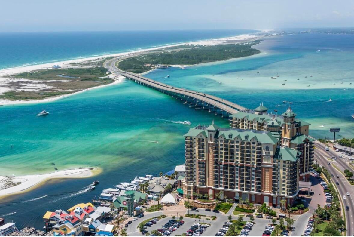 Sunrise harbor views every single day!!! This unit is in the east building with balconies facing the harbor and the boardwalk to all the shops and restaurants. It is on the Grande Vista level which houses the relaxing spa, refreshing pool and delicious bar and grill. As you enter the condo, you get a beautiful view of the balcony and the natural light highlights the spacious living area. The flooring has recently been upgraded to LVP and the walls have a fresh coat of paint. The bedrooms are all very spacious and each has a full bath. New linens adorn each bed and each room has a very luxurious feeling. There are many amenities on the property and many amenities just minutes away. Beautiful crab island is a boat ride away and the gulf is just around the corner. Come and see this beauty!