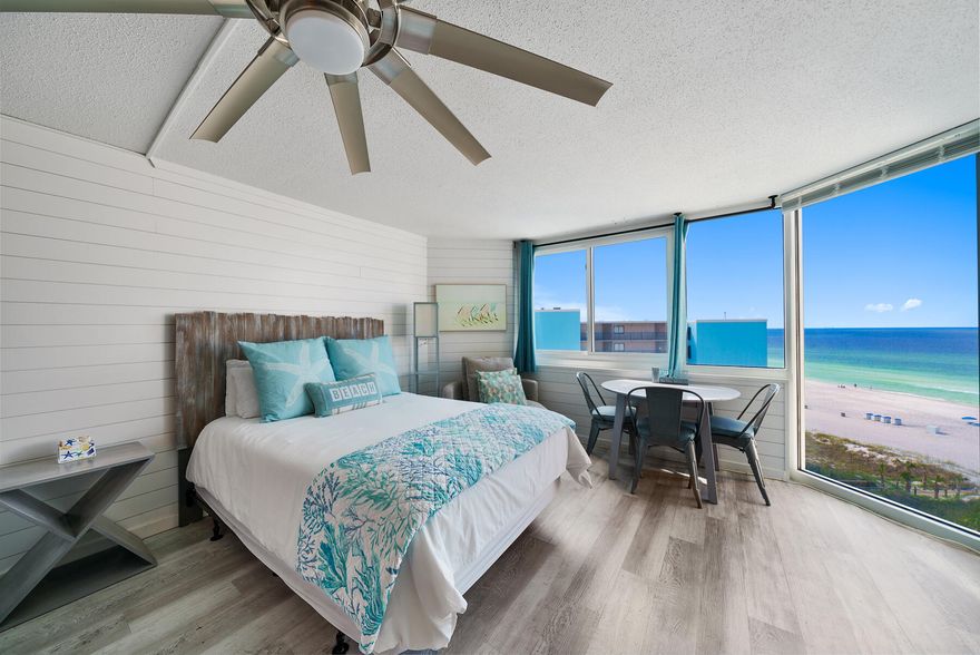 Unique opportunity to own this cozy and newly updated highly desired top floor condo with spectacular views of the Emerald Coast. This unit is offered fully furnished, featuring two new queen beds , flatscreen tv, and a dining table for four beside a floor to ceiling window overlooking the white sandy beaches. This unit is fully updated with new AC, hot water heater, and cosmetic features such as a new backsplash, appliances, countertops, wood paneling, and more. This building boasts newly redone elevators and recently resurfaced floors. Newly replaced exterior doors and windows, railings, and you can enjoy complex wide wifi. Grills are available for residents to BBQ and laundry services are available through the complex! The complex offers multiple balconies to enjoy panoramic views of the gulf, an awesome place to watch the waves crash and the vibrant sunsets. The well maintained and cozy complex of 200 condos and 8 stories offers private beach access. This appealing location is walkable to Pineapple Willy's beachfront restaurant, Signal Hill Golf Course, and many other restaurants and popular attractions. The complex is located in Top of the Gulf, a highly desired area, committed to excellence and community. This is an opportunity to own a cozy slice of paradise in Top of the Gulf. 
