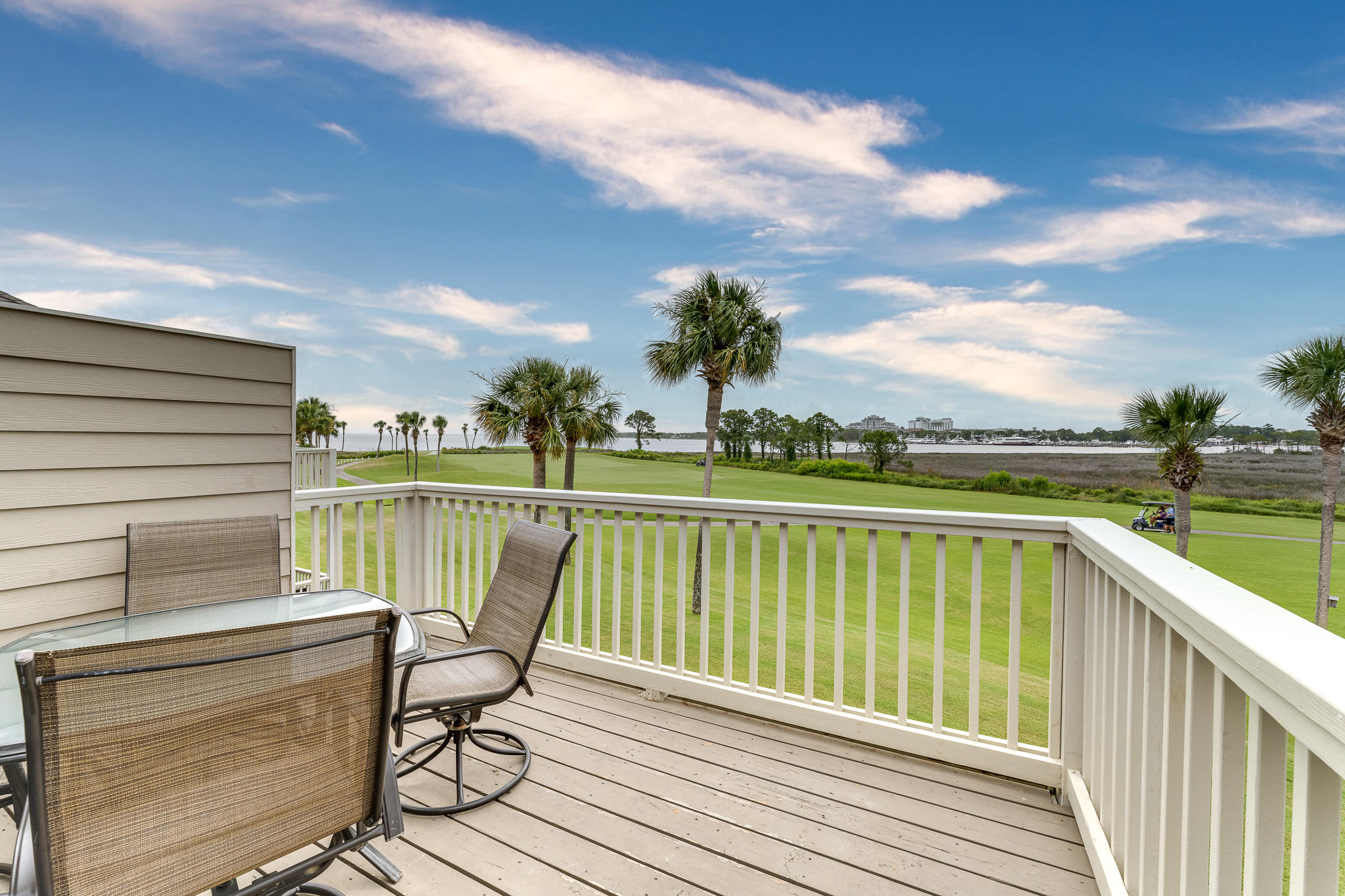 Come take a look 6/27 and embrace picture perfect panoramic bay, lake, marina, and golf course views from this second floor condo conveniently located STEPS from the neighborhood pool. Relax on the spacious balcony as you wind down from a fun filled day and take in the views. The sunrises, sunsets and weekly fireworks displays are spectacular from this second floor perch! Split floor plan provides privacy between the two bedrooms. Conveniently located a quick bike or golf cart ride to the beach, tennis center, marina, Village of Baytowne Wharf, Grand Boulevard, and 4 golf courses within Sandestin Resort. Park your flip flops, relax, and stay awhile!
