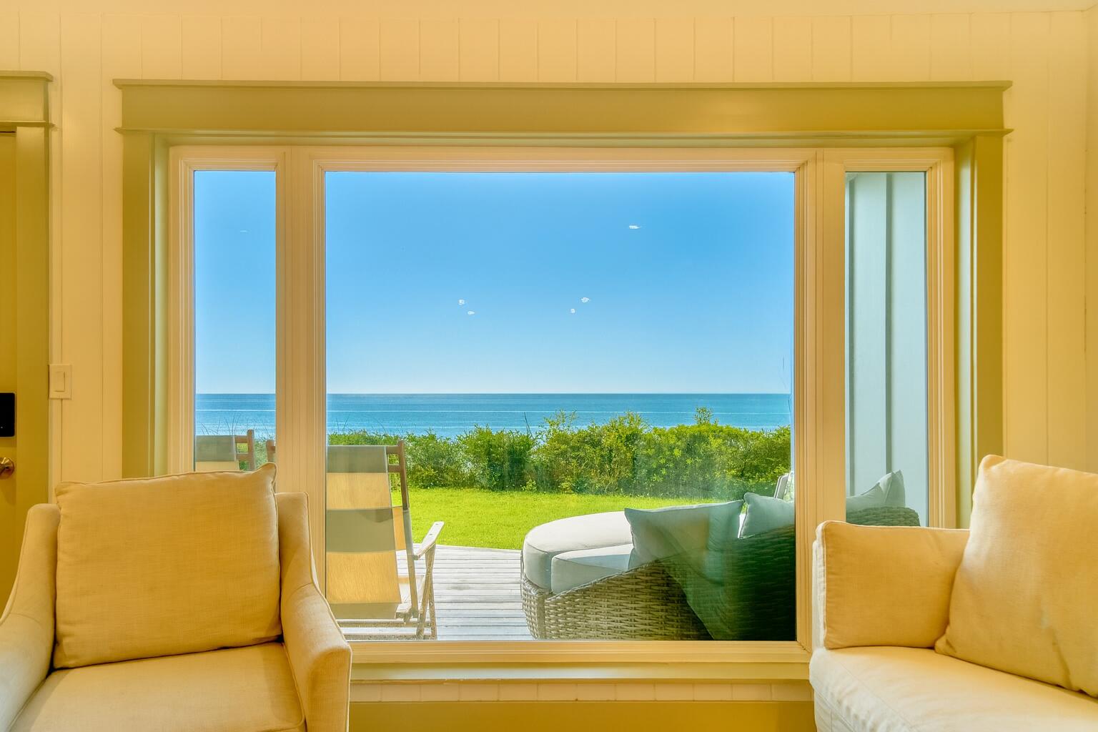 Enjoy the best and highest views on Scenic Highway 30A in this fully renovated two bedroom, two and a half bathroom condo at Sea Bluffs in Blue Mountain Beach. Sea Bluffs is nestled 65 ft above the beach and features private beach access for you and only 19 other condo units. When you enter the unit, you are greeted with gorgeous beach views through the large living room windows. The open concept plan boasts a coastal chic living room, dining room and kitchen on the main floor, in addition to a hallway bunk and a half bathroom. An inviting porch off the living room invites you to enjoy incredible sunrises and sunsets, not to mention access to a full day of playing at the beach. The second floor hosts the master suite and guest suite. Relaxation awaits in the beautiful, oversized master suite with ample sunlight from two sets of sliding doors that lead to the balcony. The master bathroom features a claw foot soaking tub, shower and double vanity complete with marble countertops and floors. The guest suite features a vaulted ceiling and generous space for guests to unwind. The guest bathroom includes an oversized shower with multiple shower heads. The condo can comfortably sleep 10 guests and has actual rental income that exceeds $100K annually. The condo was fully renovated in 2023 with custom cabinetry and solid white oak floors throughout the home, soapstone countertops in the kitchen, V groove and Shiplap walls, Moroccan Zeilege tile, furniture and fixtures from Arteriors, Rejuvenation, Visual Comfort, Pottery Barn, Anthropolgy, and more. Sea Bluffs has an agreement with La Dulce Vita for any beach chairs, umbrellas, bikes, kayaks and more.