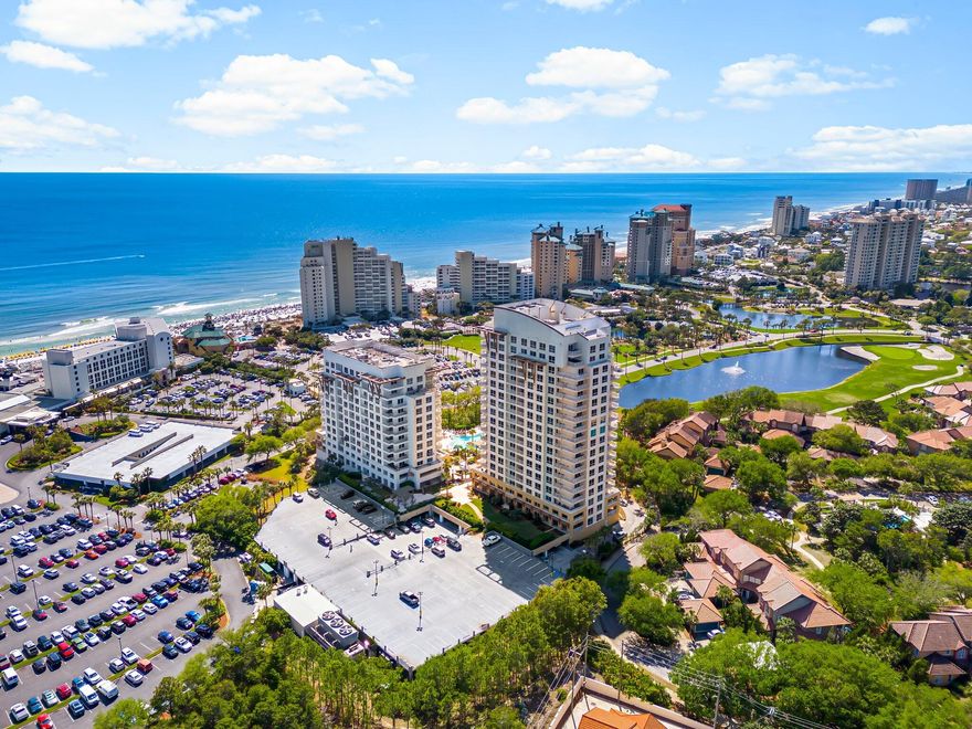 Studio Unit - Fantastic views of the Gulf of Mexico, Choctawhatchee Bay, lake, and golf course from this 8th floor studio in Sandestin's LUAU I building. This unit is beautifully appointed with updated furnishings, and plank style tile flooring. Complete with a king size bed and sleeper sofa you can comfortably accommodate 4 guests. This unit also offers a generous size full bath, kitchenette with compactfridge, microwave, and coffee maker. Plenty of space to relax on the balcony and take in all the views. LUAU I amenities include beach access, an oasis resort pool with hot tub, and waterfall, seasonal tiki hut, kids splash zone, grilling area, sundeck and onsite fitness. This unit has been well maintained and is turnkey. Gross Rental Income for 2024 was $20,400.