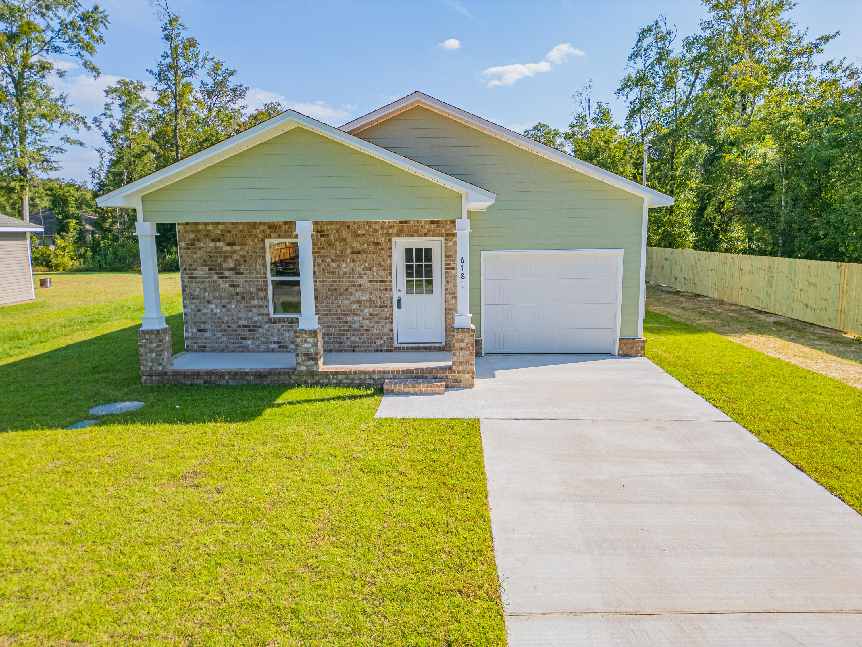 This home is now completed and ready for it's new owners. Beautiful new construction, close to I-10 so easy access to Pensacola or Milton. Brick front with Hardie Board siding, 9' ceiling through out. Luxury vinyl flooring through out, no carpet! Granite counter tops in the kitchen, stainless steel appliances. Large covered porch off the back of the house.