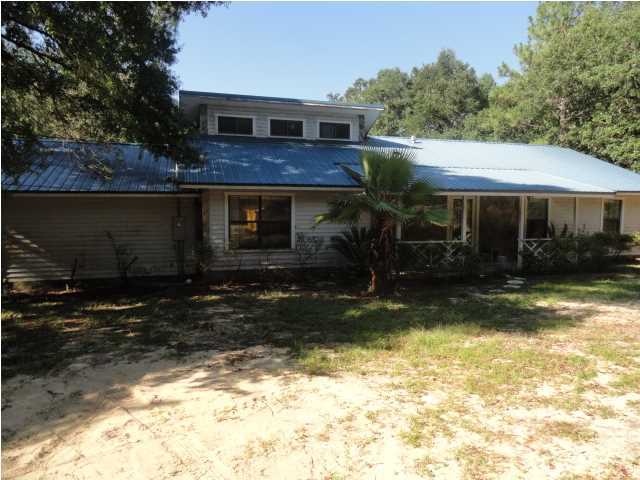 Renovated home with new carpet, Paint, New HVAC, new decks on the rear outside of living room and master bedroom. The garage was enclosed for additional living space and does have an extra bedroom. Spacious Home with plenty of room to roam. The large living room has a wood burning fireplace with stone accents that also accent the floor. A spacious eat in kitchen is perfect for family time. Large parcel feels like your in the country, yet your right in town. There is a large storage building for storing all the outside toys and gardening tools. The possibilities are endless with this property.