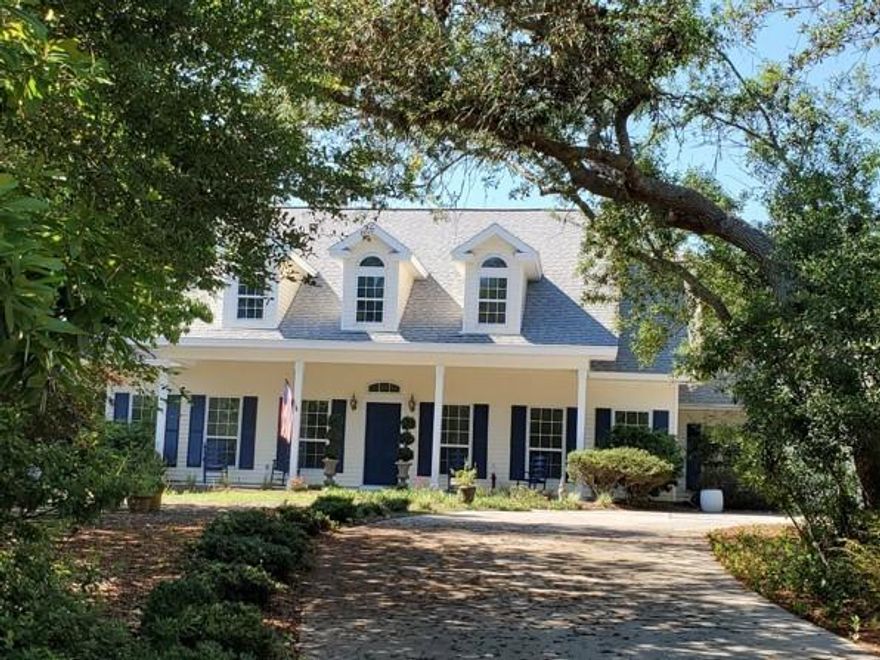 Classic Southern architecture and charm, breezy gracious porches in both the front and back, and a private yard that offers a beautiful pool in an extremely peaceful setting all within easy walking distance to the private gated walkover to the Gulf of Mexico. Four bedrooms, 2 -1/2 baths, an office, large laundry room and an open concept living area are complimented by numerous and large windows that invite the outside in. The two car garage has floor to ceiling peg board along the wall for hanging items as well as a large storage closet.
The home has 2799 square feet of living space and the beautiful lot is over a half acre in the desirable Seabreeze neighborhood right off scenic 30a.