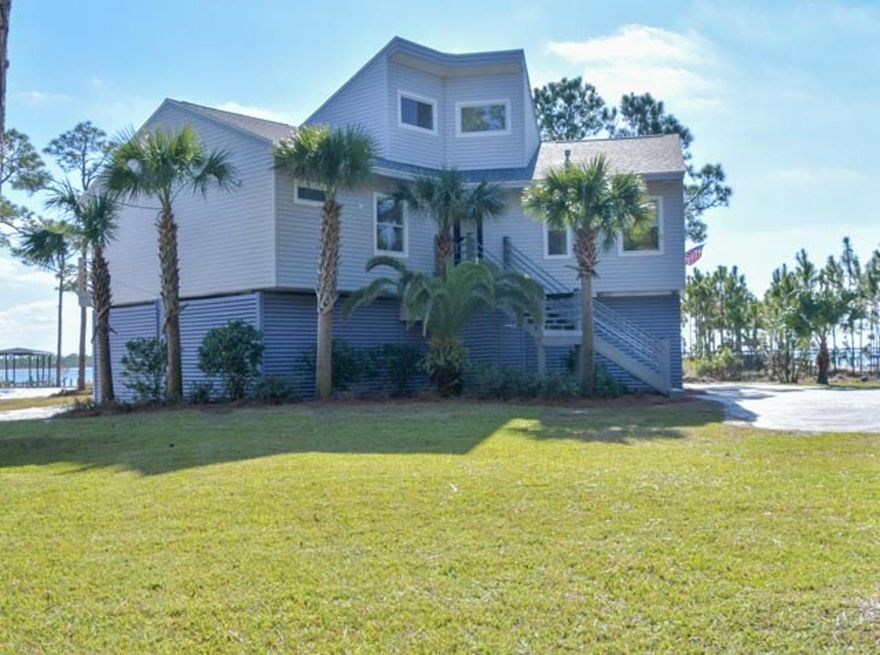 Welcome home to an incredible Waterfront Estate. This 1670 square foot,  4 bedroom, 2 bathroom remodeled Beach House is situated on a 1.2 acre waterfront lot. Watch the dolphins play, enjoy the wildlife that the intercoastal water way has to offer. Boating, fishing and private beach are just a few of the amenities that are included. Two boat slips, including Boathouse with a 5000 lb. lift to park your boats. Incredible sunrises and sunsets are just part of this waterfront lifestyle. Freshly and tastefully remodeled to a high standard. New kitchen, New master bath and professional landscaping that includes inground lighting, add a welcoming feel as you enter the property. New roof, New HVAC and updated kitchen and master bathroom make this home feel brand new.
