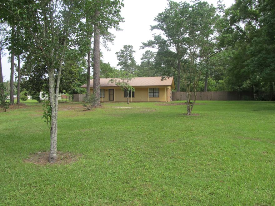 Great home located just South of DeFuniak Springs,   This 2 bedroom/2 bath home features open floor plan, large master bedroom with walk-in closet and spacious master bath.   Kitchen features island storage and large dining space for family to gather.  Large closet in guest bath give added storage. The 10' x 18.5' patio and fire pit are perfect for outdoor enjoyment with fencing that provides additional  privacy.  Back yard is large enough to build pool if desired.   Home was originally built as 3 bedroom/2 bath but remodeled for large master suite. Property is convenient to everything - Shopping Center 1.5 miles, Historic District of DeFuniak Springs 5 miles, Choctawhatchee Bay 19 miles,  and South Walton beaches 27 miles.  Schedule your showing today.
