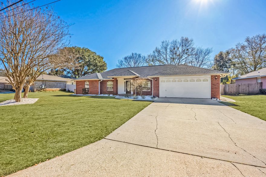 Welcome to this charming 3-bedroom, 2-bathroom brick pool home located in the heart of Pace, just off Woodbine. This beautifully updated property offers a perfect blend of modern features and timeless comfort, making it an ideal place to call home. This home features a 2022 roof, new LVP flooring, and fresh paint throughout. Step inside to discover an inviting open concept floor plan that seamlessly connects the living, dining, and kitchen areas. The updated kitchen is a true highlight, featuring butcher block countertops, a brand-new farmhouse sink, and stylish new cabinet hardware. The kitchen flows effortlessly into the dining area and spacious living room, where cathedral ceilings, built-in shelves, and a cozy wood-burning fireplace provide a warm and welcoming space for family gath erings or entertaining guests. The sunroom at the rear of the house leads out to a fully fenced backyard, a true oasis for outdoor living. Featuring an inground saltwater pool complete with a new pump, saltwater filter, and saltwater cell, making maintenance a breeze. The backyard also includes a spacious yard and a shed for extra storage, providing ample space for all your outdoor activities and needs. The split primary bedroom is a private retreat, boasting a generous layout with a tray ceiling that adds a touch of elegance. The ensuite bathroom has been thoughtfully updated with a new double vanity topped with quartz countertops, a new shower, new toilet, as well as a garden tub and a walk-in closet, offering both luxury and convenience. On the other side of the home, you'll find two additional bedrooms, each featuring new trim, and a fully updated bathroom with a new vanity, shower, and toilet. This delightful home offers everything you need for comfortable living and entertaining, all in a convenient location in Pace. Don't miss the opportunity to make this beautiful property your own!