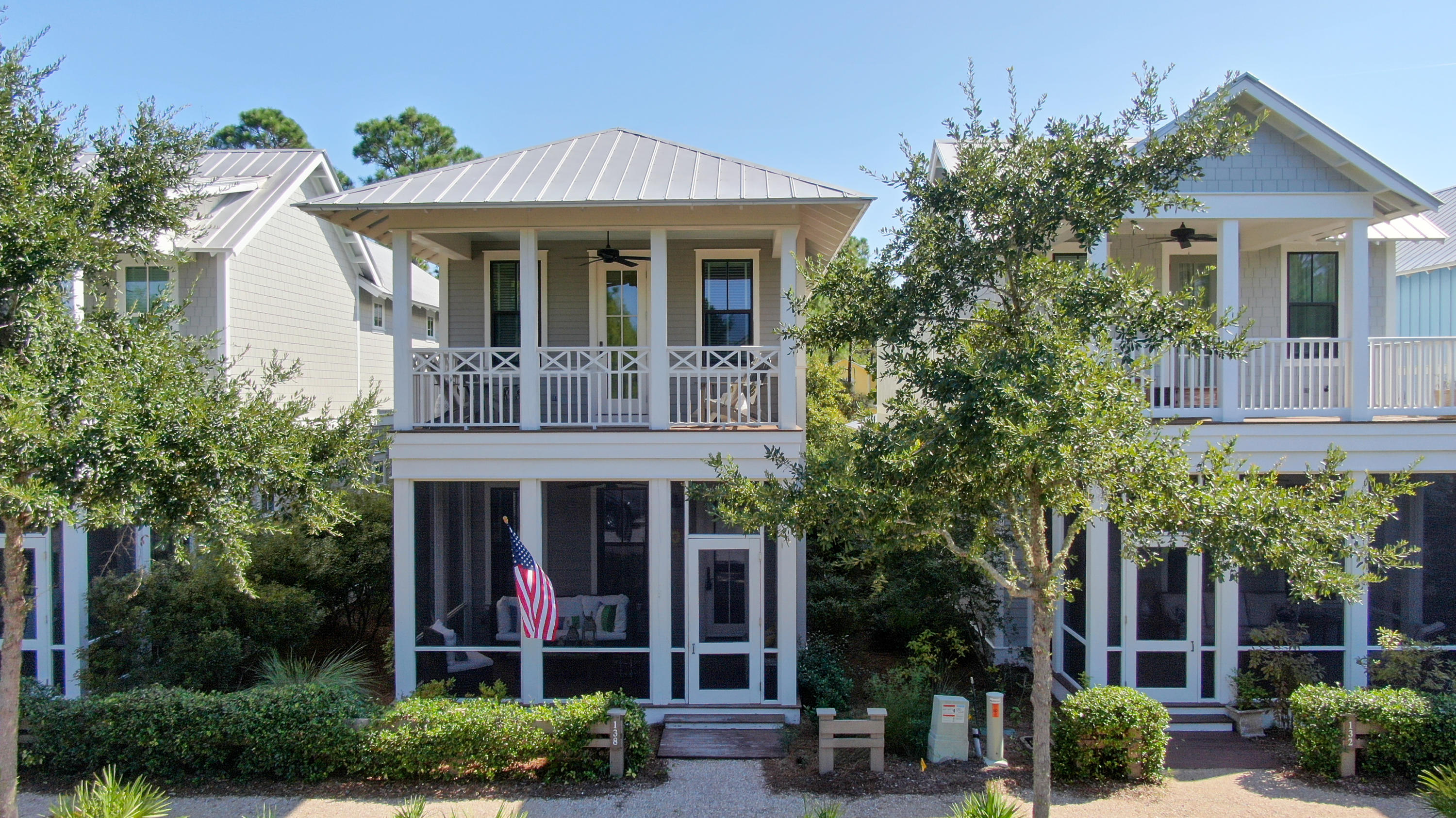 Located in the Crossings District, just steps away form DragonFly Pool, this impeccably kept home has it all. The spacious floor plan includes 4 bedrooms, including 2 master suites, 4 1/2 baths and a bunk room. There are hardwood floors throughout the living areas on both floors. The 1st floor welcomes you through the screened porch and into the open concept heart of the home. The 2nd floor includes a large master suite, with open outdoor porch, master bath, plus 2 additional spacious bedrooms. This home also includes an outdoor shower and golf cart garage, perfect for extra storage.