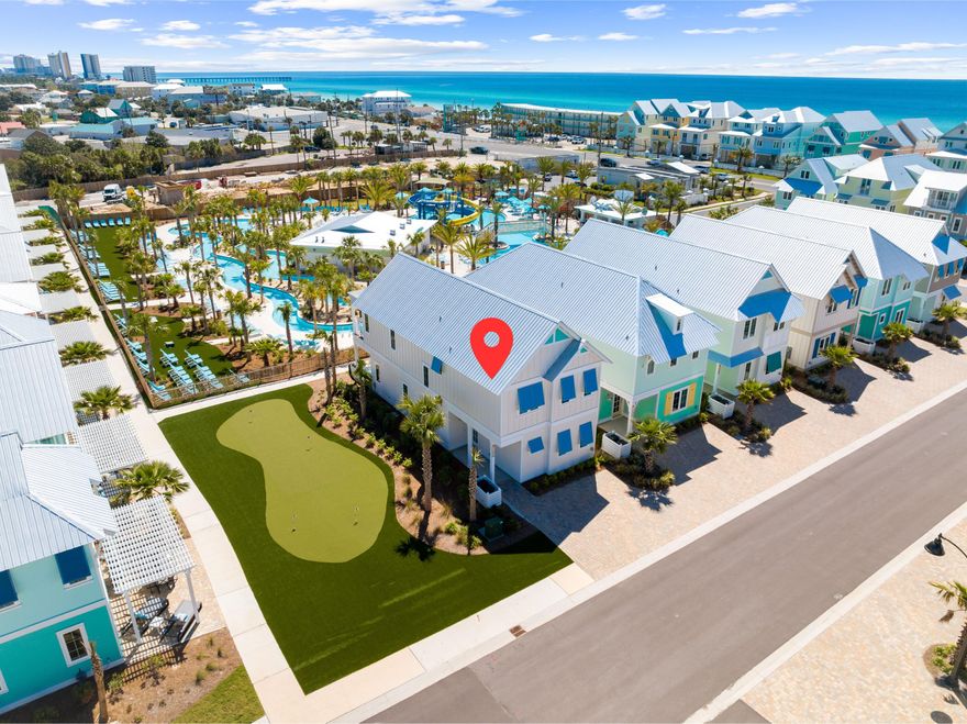 Are you ready to enjoy paradise? This brand new home is located in the hottest development in all of North Florida - Margaritaville Beach Cottage Resort! The home features 5 bedrooms and 4.5 baths on two floors of living space. This beautiful coastal Caribbean home is centrally located within the resort with lush landscaping and just steps from the resort amenities. The moment you walk through the front door you will feel like you are in paradise. The well-appointed home has a upscale, soft, coastal vibe accented by pops of fun color and art that let you know you are in Margaritaville. The open concept first floor has a chef's kitchen with huge island, quartz countertops, soft close maple cabinets, and stainless Frigidaire appliances including a six-burner gas cooktop. The first floor...