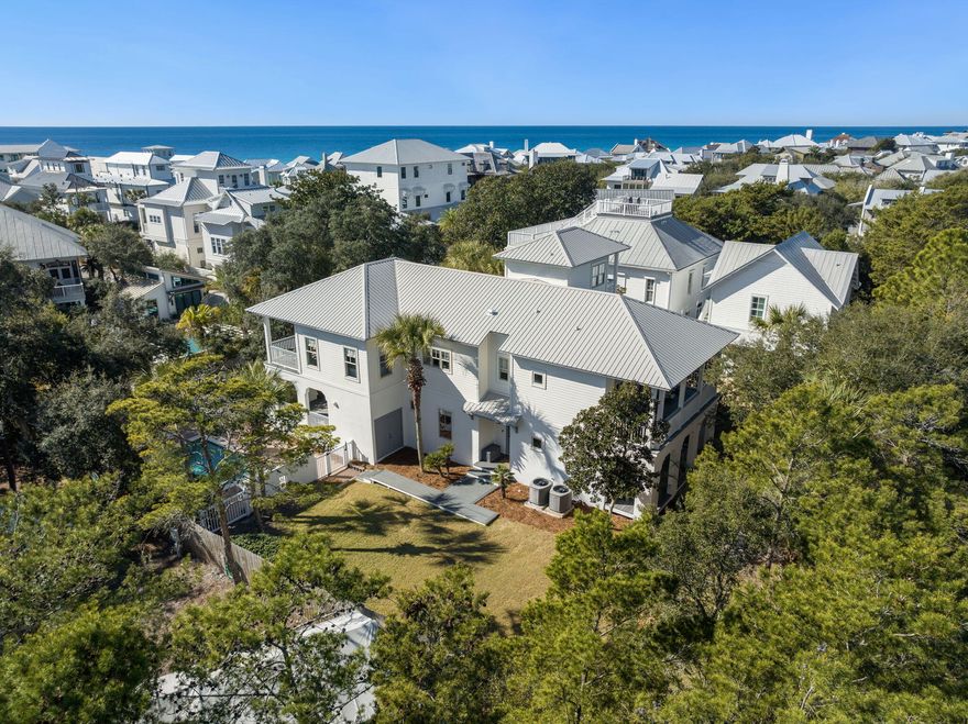 Located in the Inlet Beach community south of Scenic Highway 30A in South Walton County, this beach-style single-family home offers 3,072 square feet of updated living space with 4 bedrooms, 3 full bathrooms, and a private heated pool just one block from large public beach access and one block from Rosemary Beach. The property sits on a quarter-acre lot and provides convenient access to the coastal amenities that make Inlet Beach one of the most sought-after areas along 30A.The main living level features an open layout connecting the family room, kitchen, dining area, and primary bedroom, creating a bright and welcoming central gathering space. The kitchen was extensively updated with Thermador appliances including a gas range, quartz countertops, a large custom island with cabinetry, under-cabinet lighting, and perimeter cabinets with glass accents. Architectural details such as a rough sawn ceiling beam, recessed lighting, and updated fixtures enhance the open flow between the living and dining areas.

Bathrooms throughout the home were fully renovated with new cabinetry, marble flooring, expanded tiled showers, updated plumbing fixtures, frameless glass enclosures, and modern lighting. Bedrooms feature updated furnishings, recessed lighting, ceiling fans, shiplap accent walls in the primary suites, and custom-built bunk beds that add flexibility for guests.

Recent improvements include a new metal roof installed in March 2025 with a 40-year manufacturer warranty and a five-year workmanship warranty and a new Pentair pool pump. Outdoor upgrades include a new privacy fence, pool gate, paved entry and parking area, landscape lighting, irrigation system with groundwater well pump, a Trex boardwalk at the rear of the home, and a new outdoor shower. 

The location provides quick access to dining, shopping, and coastal destinations throughout Inlet Beach, Rosemary Beach and Scenic Highway 30A.

With its extensive updates, flexible multi-level layout, private heated pool, ample driveway parking and immediate proximity to public beach access, the home is well suited for a primary residence, second home, or investment property.